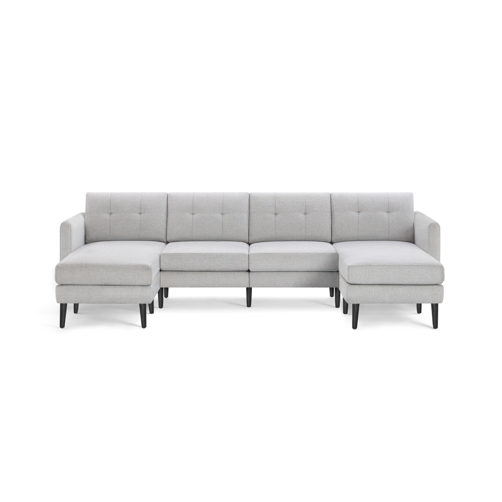 Light gray, modern sectional sofa with tufted back cushions, L-shaped design, left and right chaise ends, and black wooden legs.