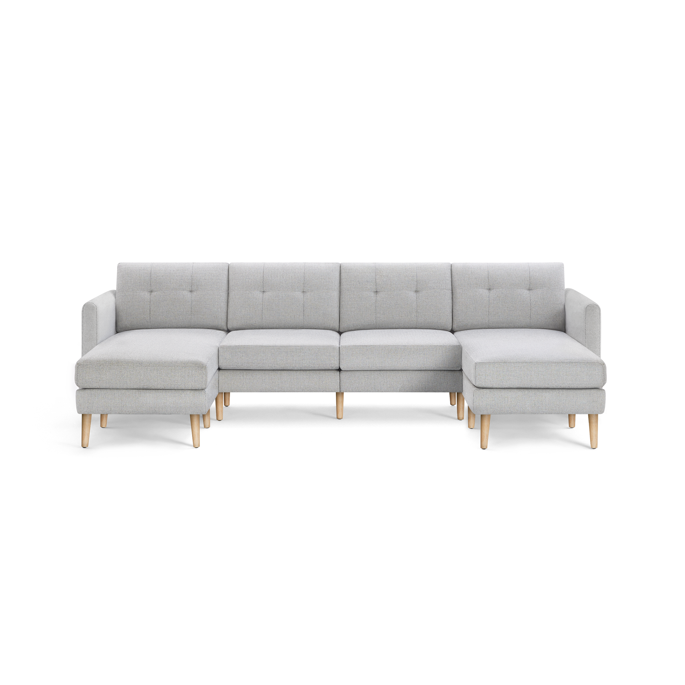 Light gray fabric sectional sofa with tufted back cushions, wooden legs, and chaise lounges on both ends, modern design.