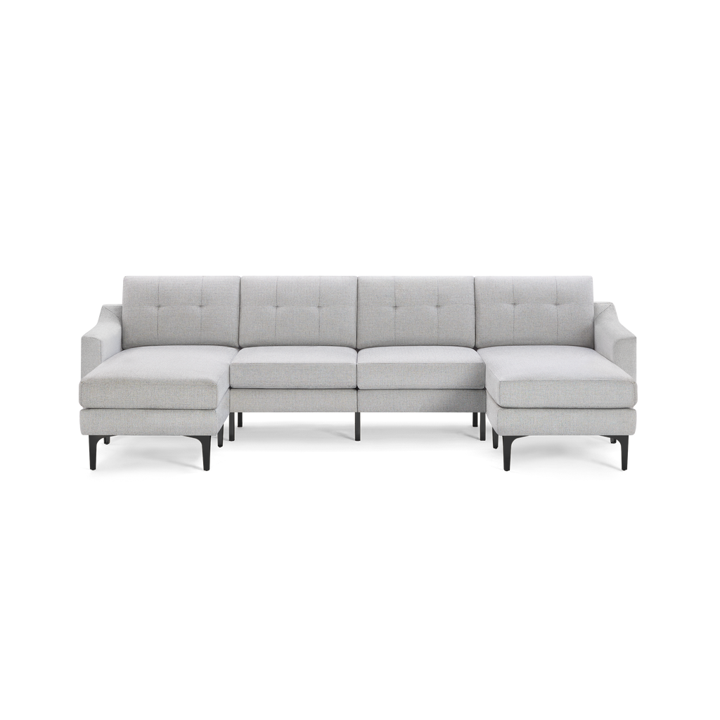 Light gray modern sectional sofa with tufted back cushions, black metal legs, and chaise lounge on both ends.