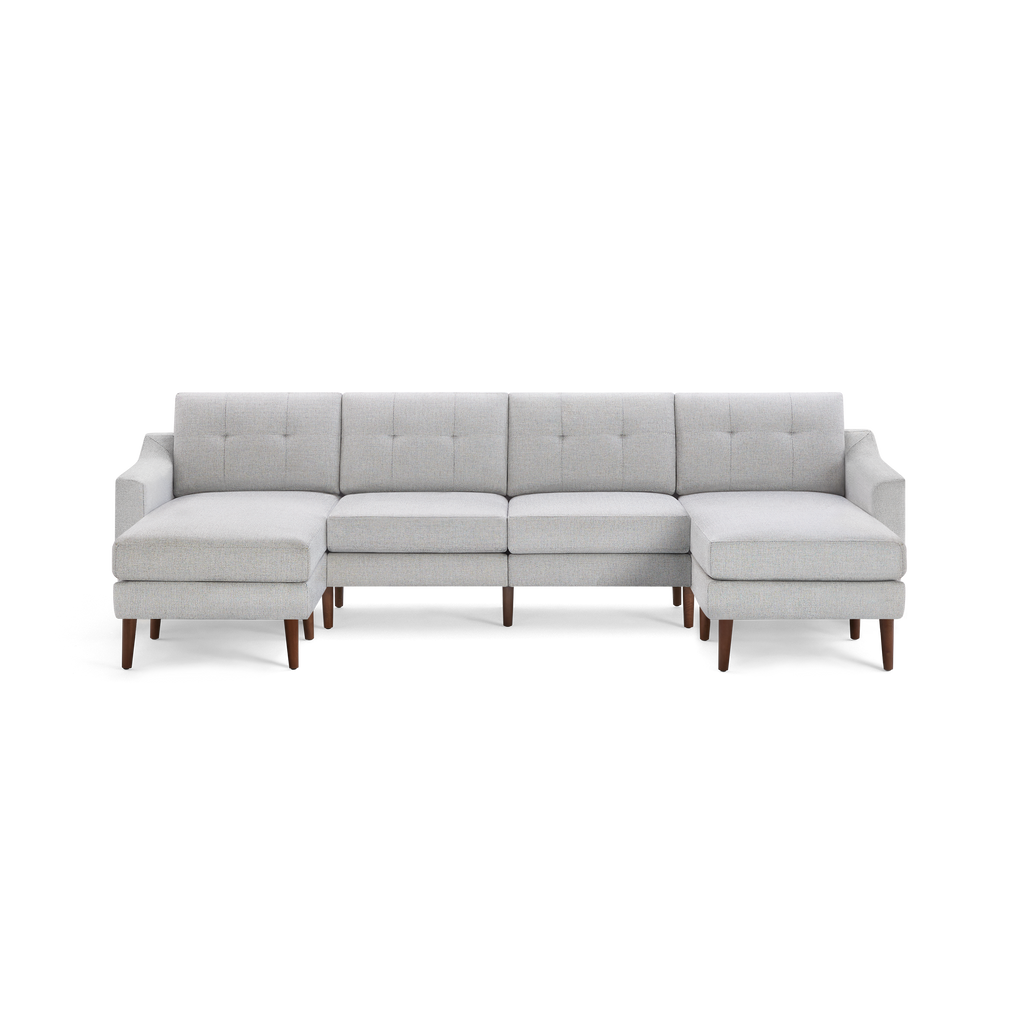 Modern light gray sectional sofa with tufted back cushions, wooden legs, and left and right chaise lounges.