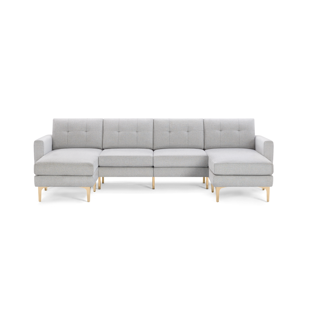 Light gray modern sectional sofa with tufted back cushions and slim gold metal legs, featuring left and right chaise ends.