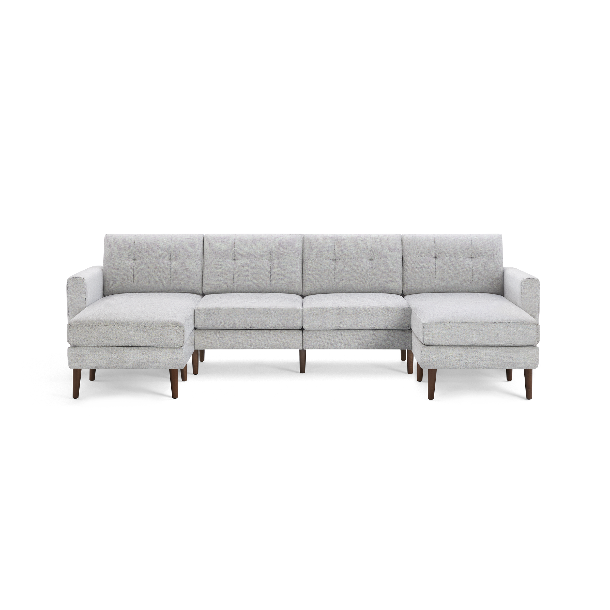 Light gray fabric sectional sofa with tufted back cushions, wooden legs, and chaise lounges on both ends.