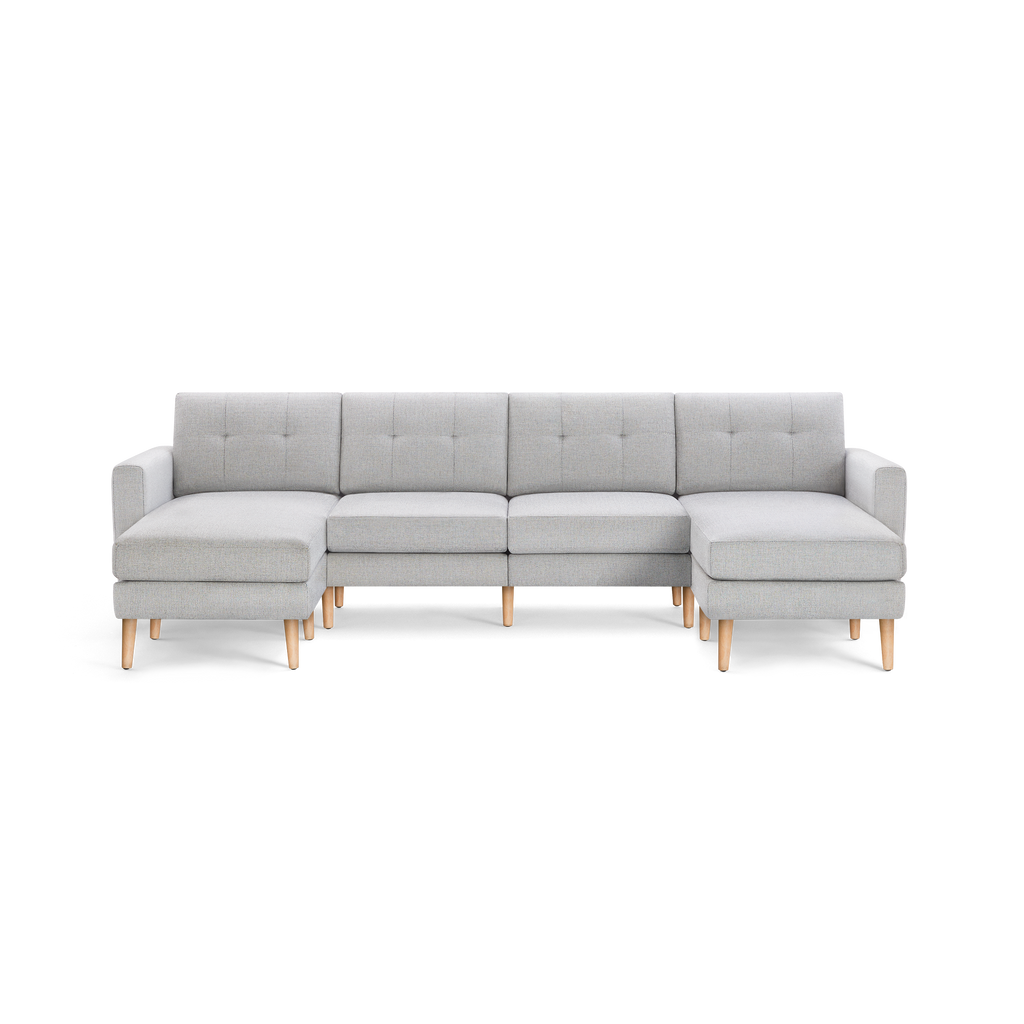 Light gray fabric sectional sofa with tufted cushions, wooden legs, armrests on both sides, chaise lounges on left and right ends.