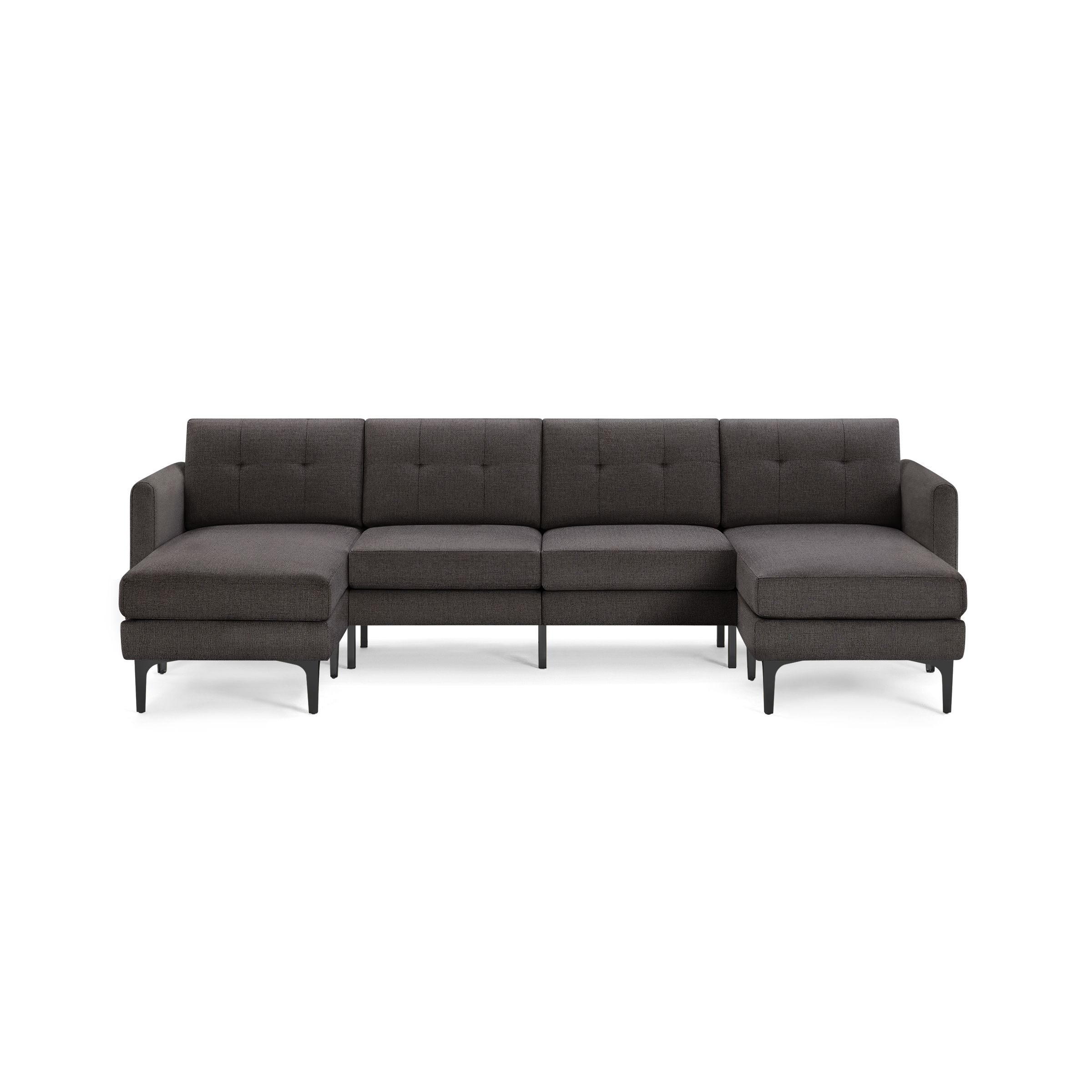 Large modern sectional sofa with dark gray tufted fabric upholstery, chaise lounges on both ends, and sleek black legs.