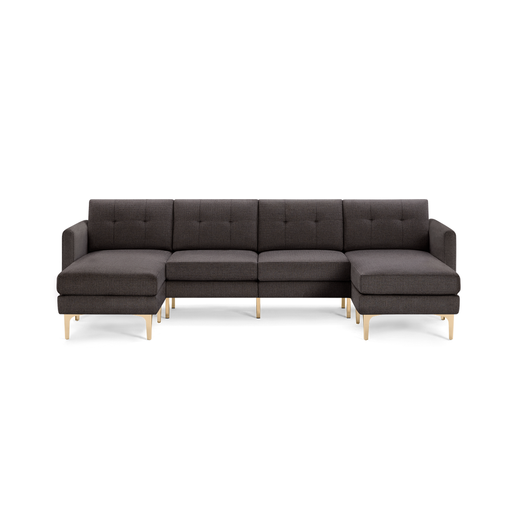 Dark gray sectional sofa with tufted back cushions, two armrests, and light wooden legs, featuring left and right chaise lounges.