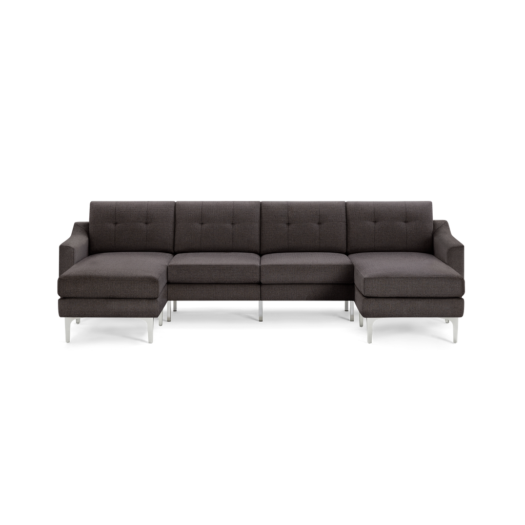 Modern dark gray sectional sofa with chaise lounges on both ends, tufted back cushions, and sleek metal legs.