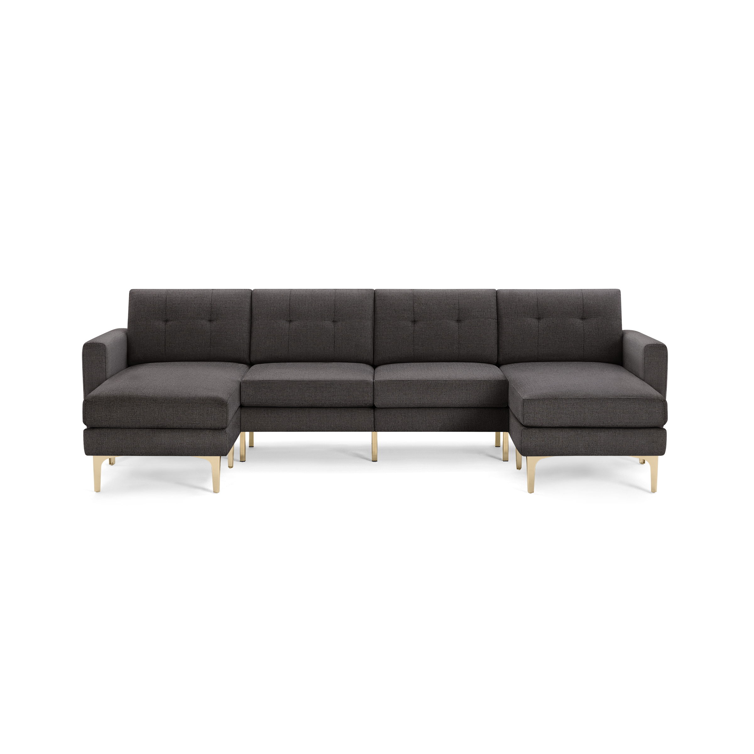 Dark gray modern sectional sofa with tufted back cushions, L-shaped design, and light wooden legs, isolated on black background.