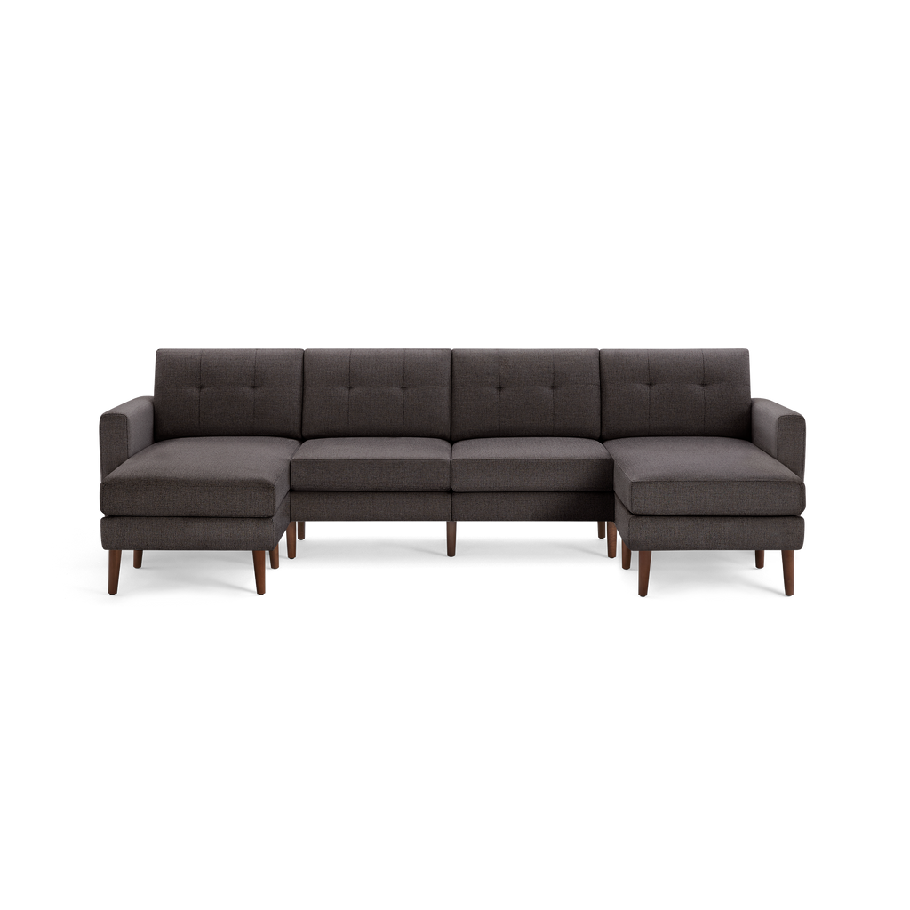 Dark gray L-shaped sectional sofa with tufted back cushions and wooden legs, featuring both left and right chaise lounges.