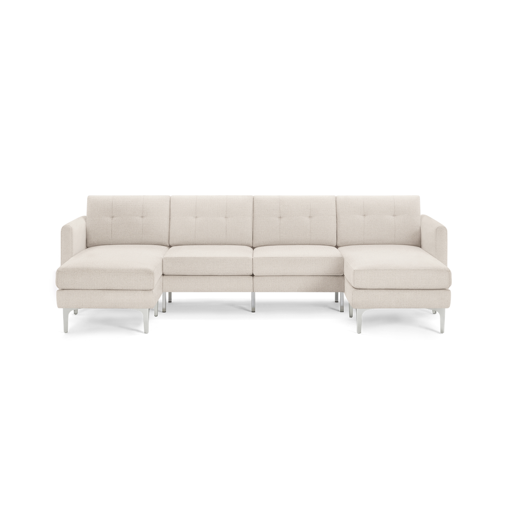 Modern beige sectional sofa with tufted backrests, metal legs, and chaise lounges on both ends.