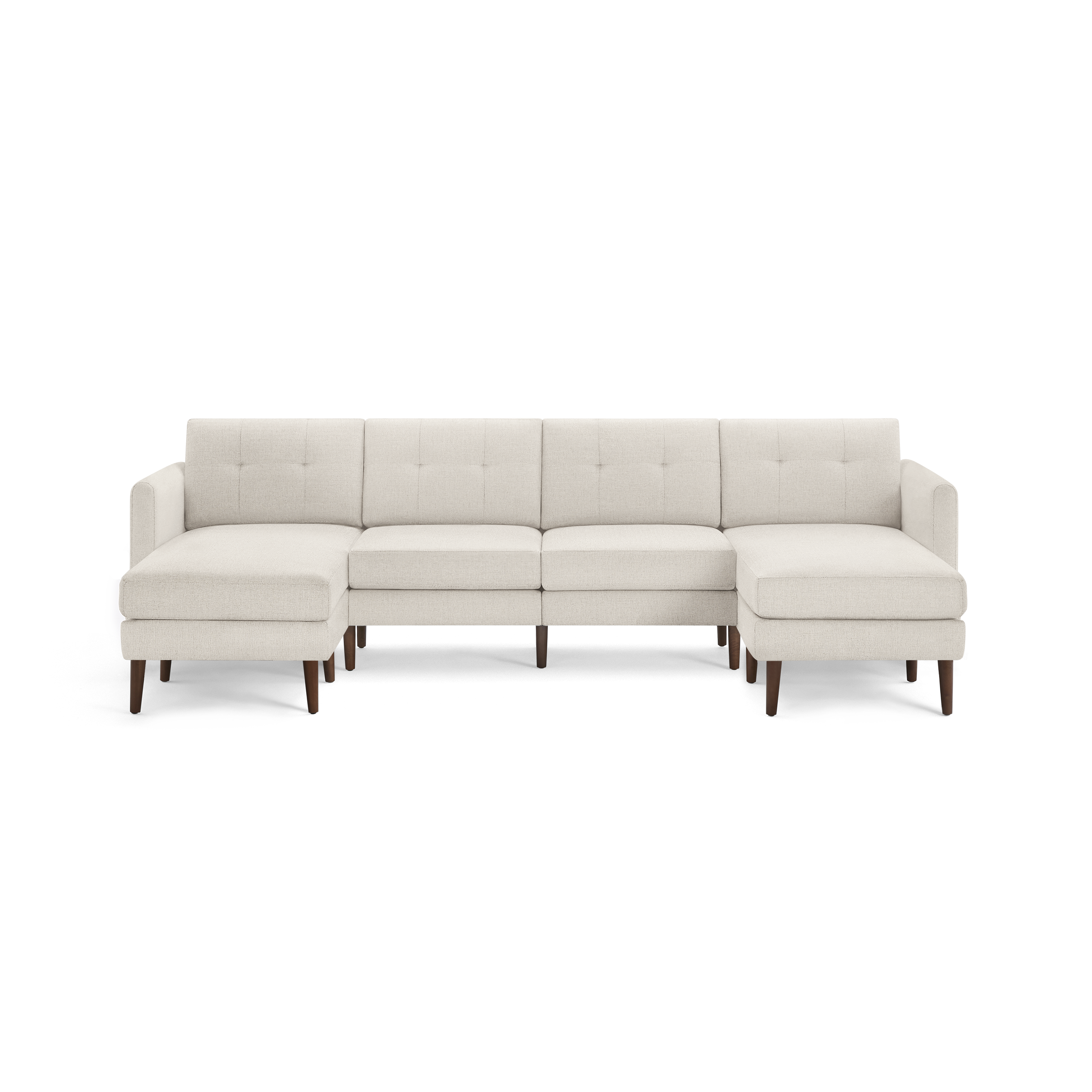 Cream-colored modern sectional sofa with tufted back cushions, wooden legs, and chaise lounges on both ends.
