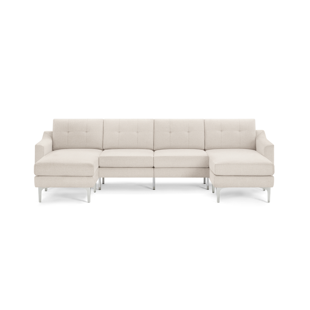 Beige modern sectional sofa with tufted back cushions, chaise lounges on both ends, supported by silver metal legs.