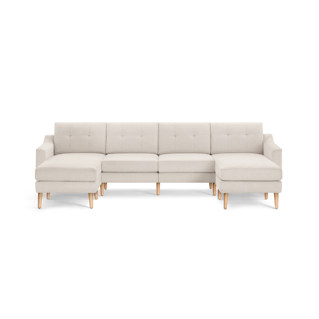 Modern beige fabric sectional sofa with tufted backrest, wooden legs, and two chaise lounges on each side.