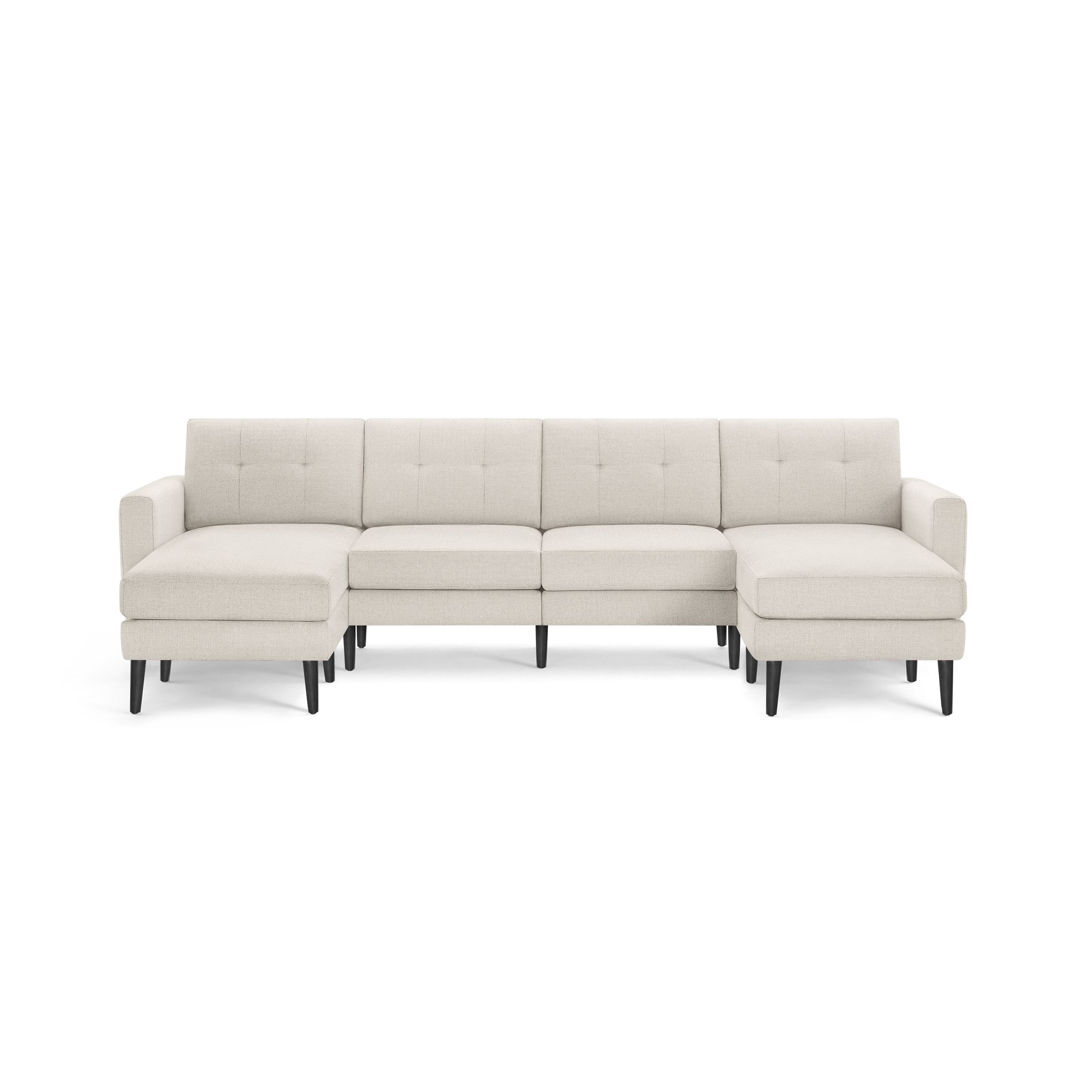 Cream-colored fabric sectional sofa with tufted back cushions, L-shaped design, and black wooden legs.