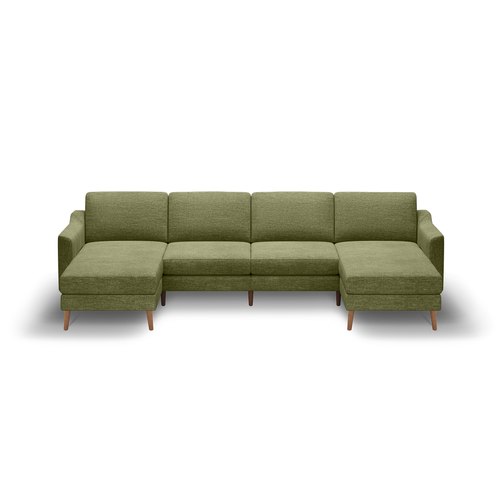 Olive green fabric sectional sofa with left and right chaise lounges and wooden legs on black background.