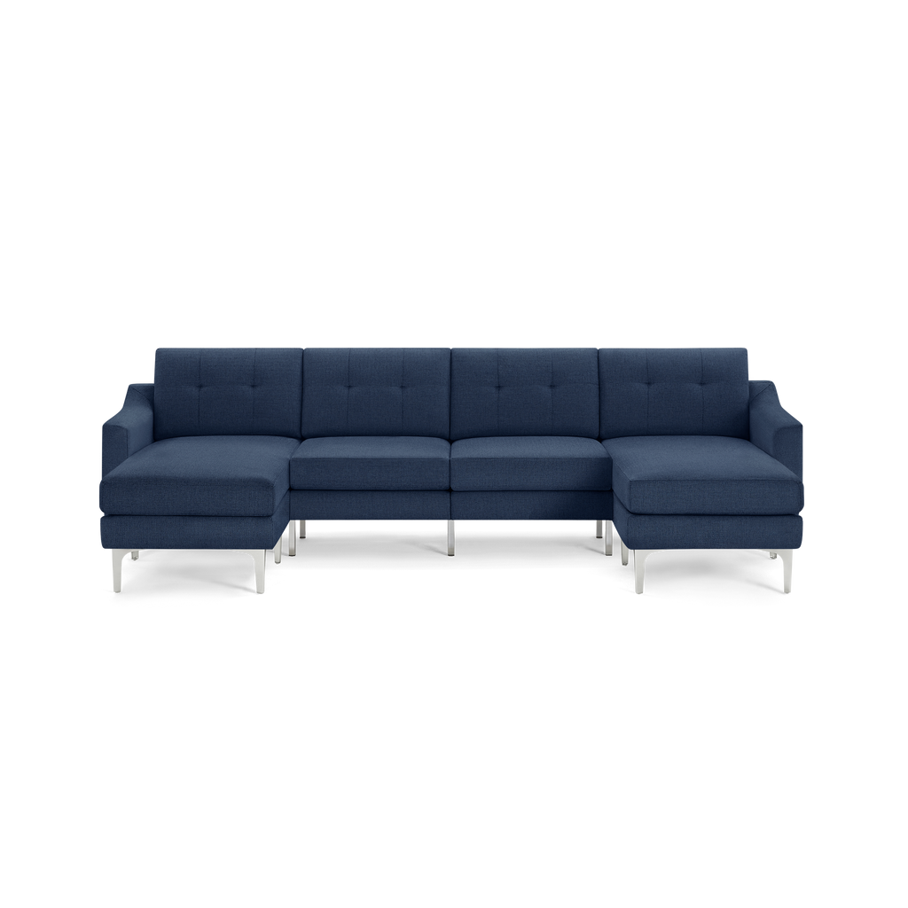 Large modern navy blue fabric sectional sofa with tufted cushions and slim silver metal legs, featuring left and right chaise lounges.