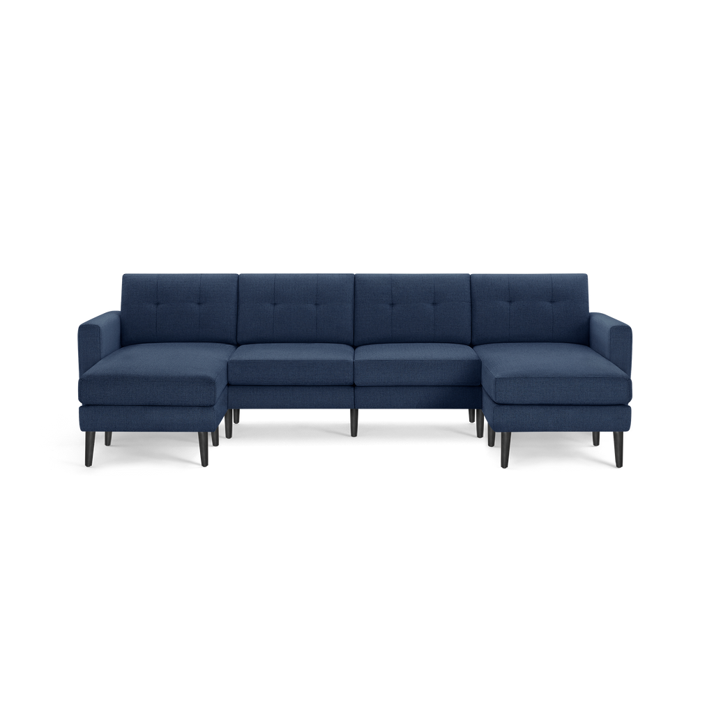 Modern navy blue fabric sectional sofa with tufted back cushions and black wooden legs, featuring left and right chaise lounges.