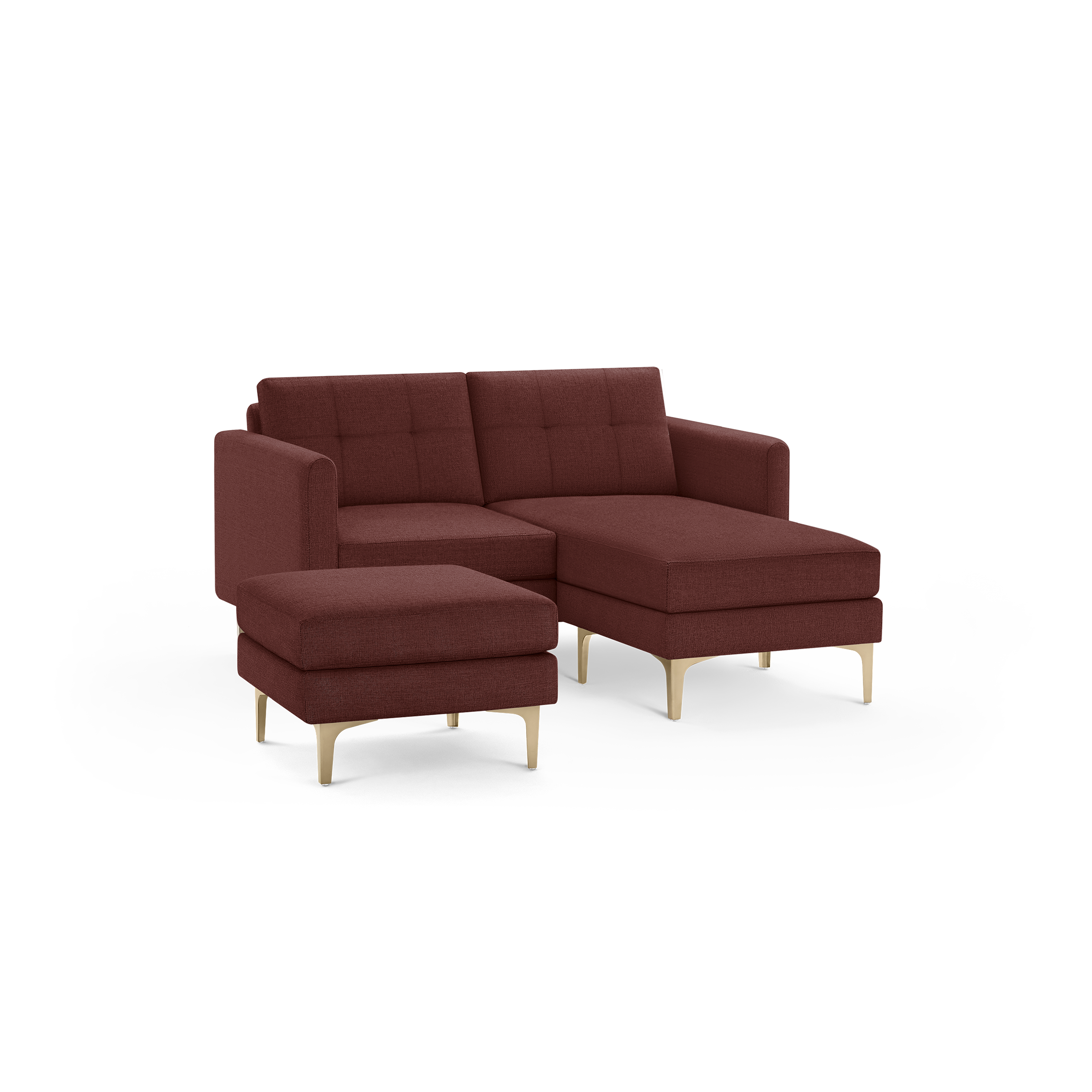 Modern mid-century style sectional sofa in deep red fabric with tufted cushions, wooden legs, and matching ottoman.