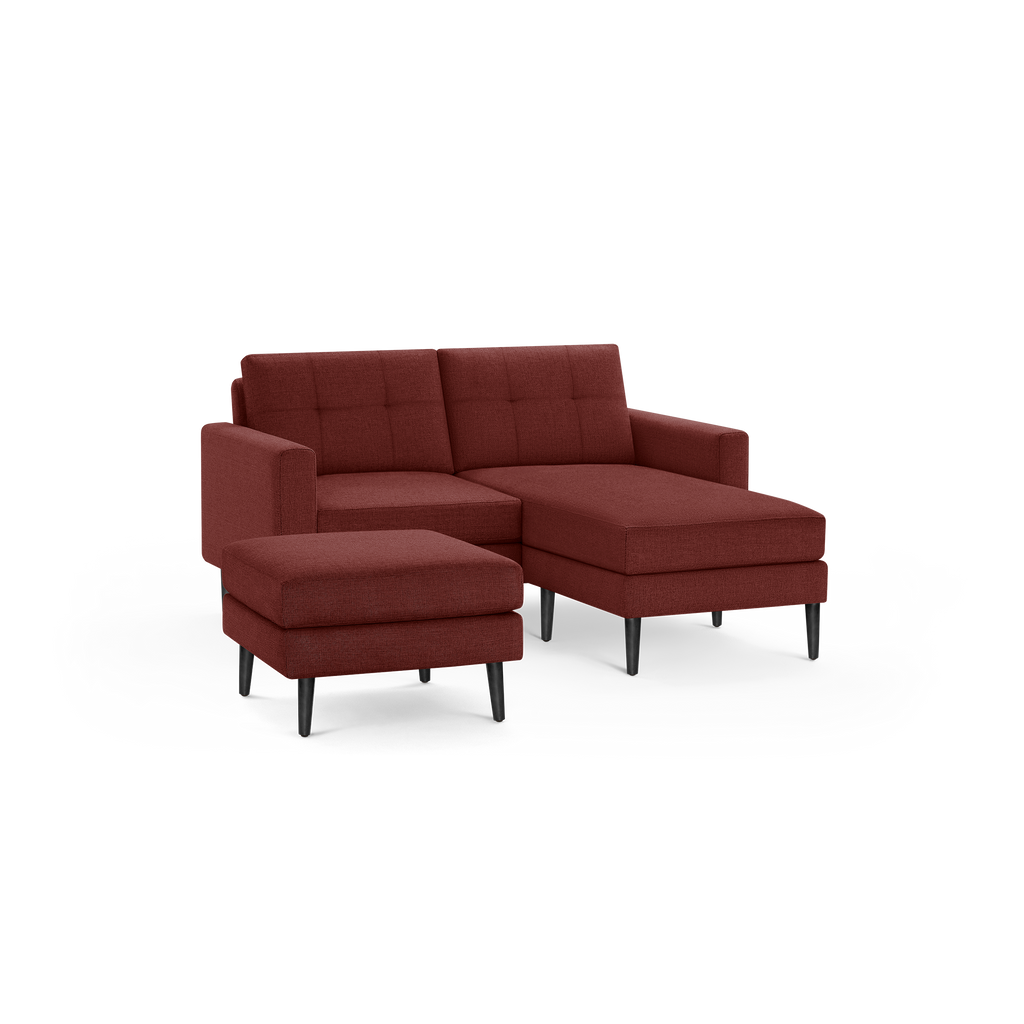 Modern burgundy fabric sectional sofa with tufted back cushions, right chaise, and matching ottoman on black tapered legs.