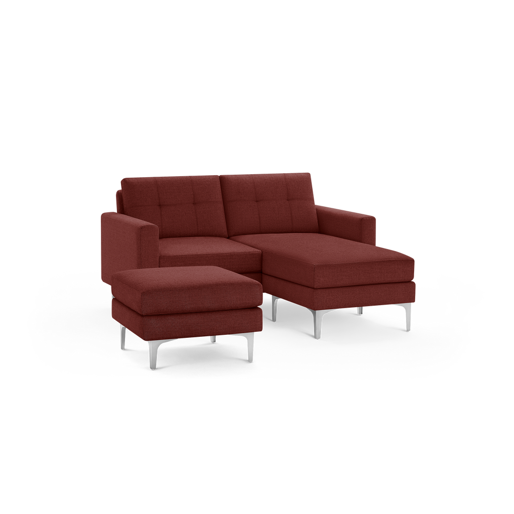 Modern red fabric sectional sofa with tufted back cushions and metal legs, featuring a chaise lounge and a matching ottoman.