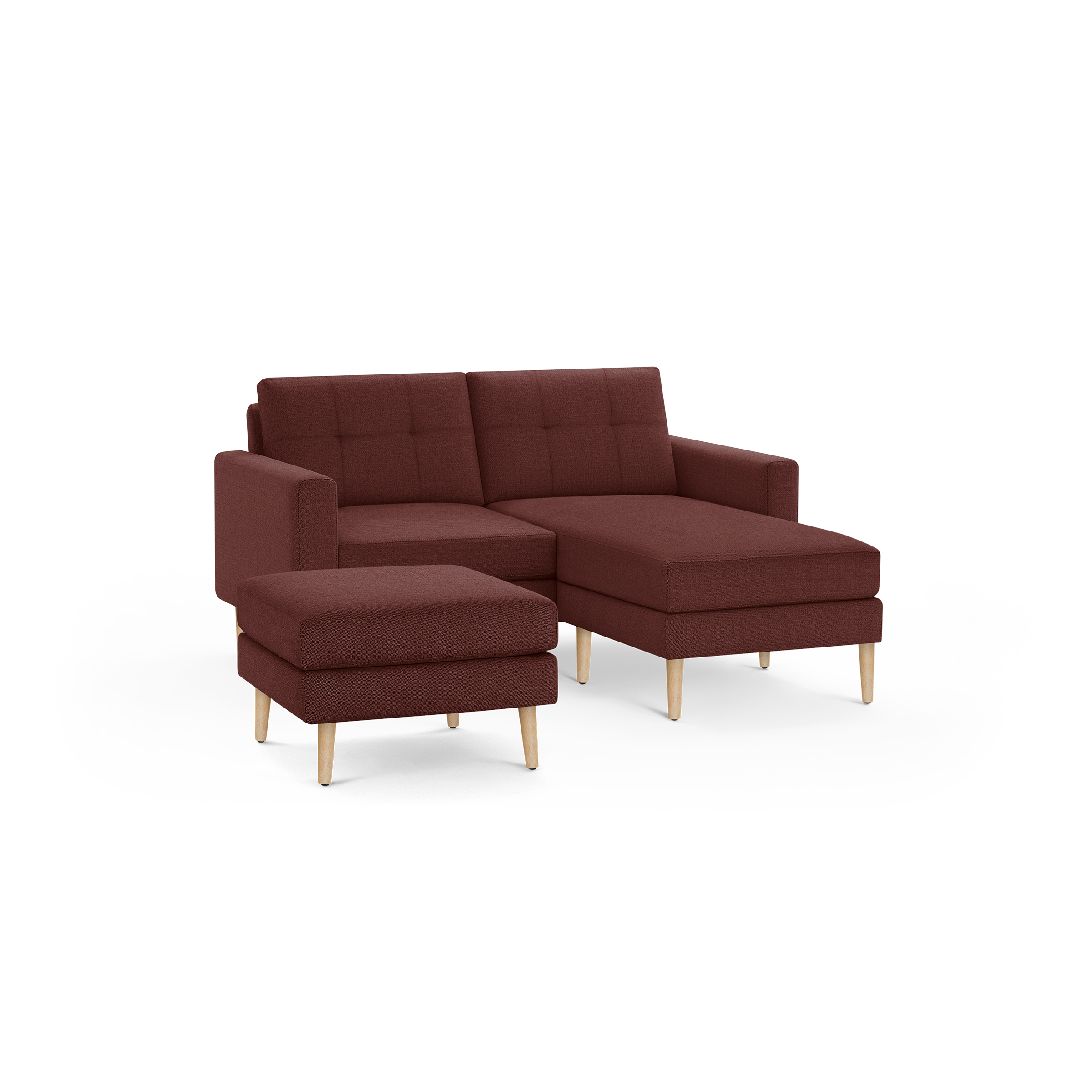 Modern L-shaped sectional sofa with chaise and matching ottoman, upholstered in deep red fabric with wooden legs.