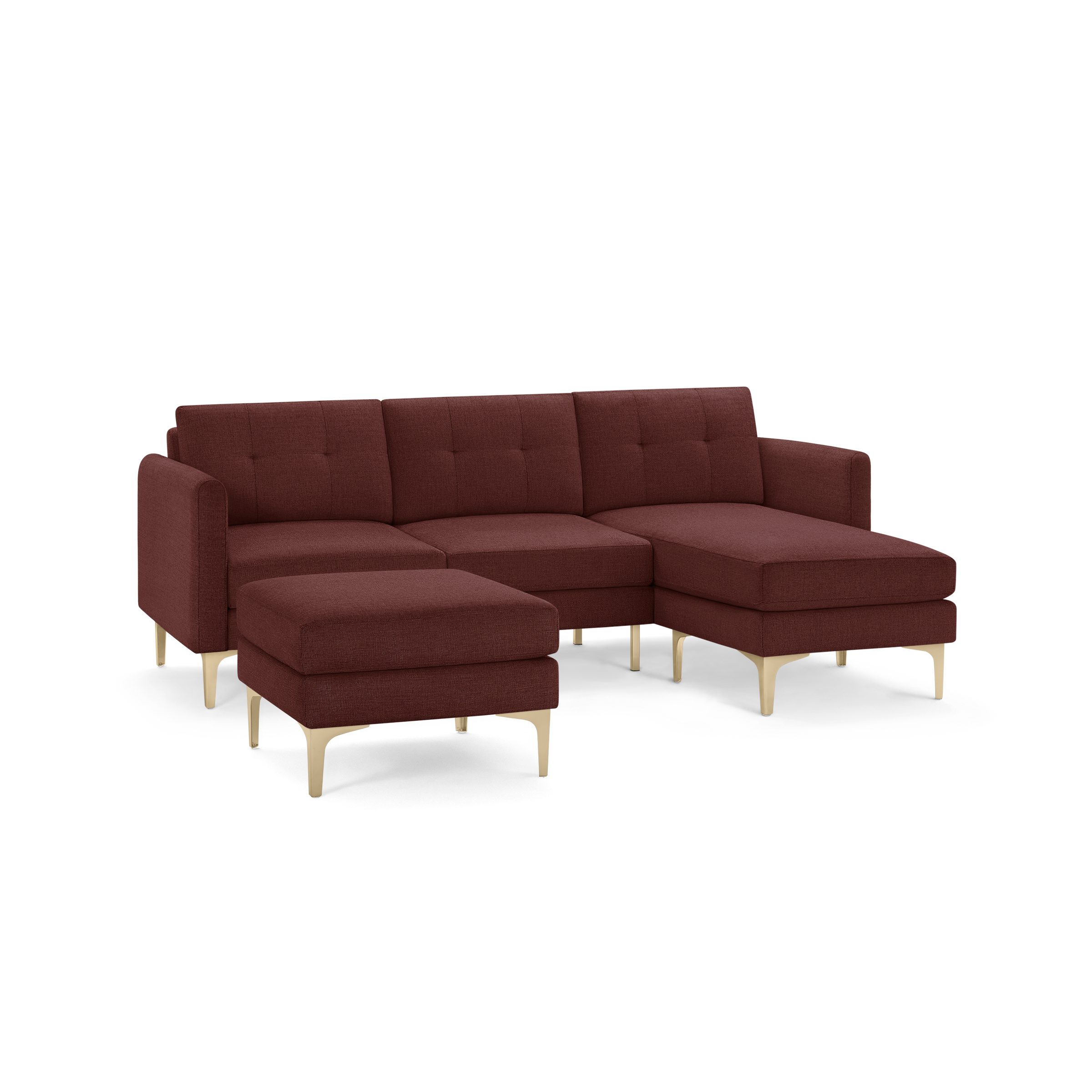 Modern red fabric sectional sofa with tufted cushions, chaise lounge on the right, and matching ottoman with light wooden legs.