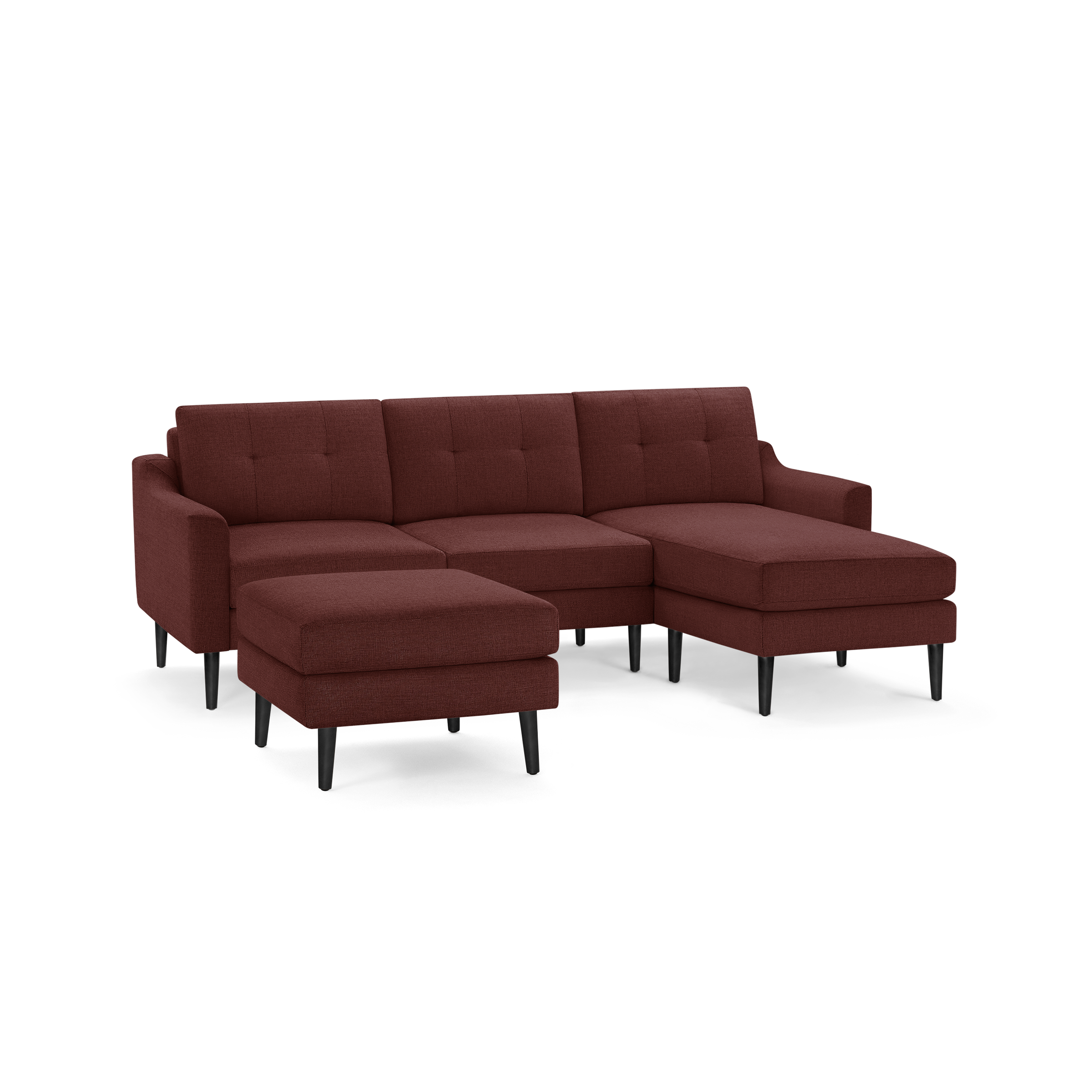 Modern sectional sofa with deep red fabric upholstery, tufted back cushions, black tapered wooden legs, and matching ottoman.