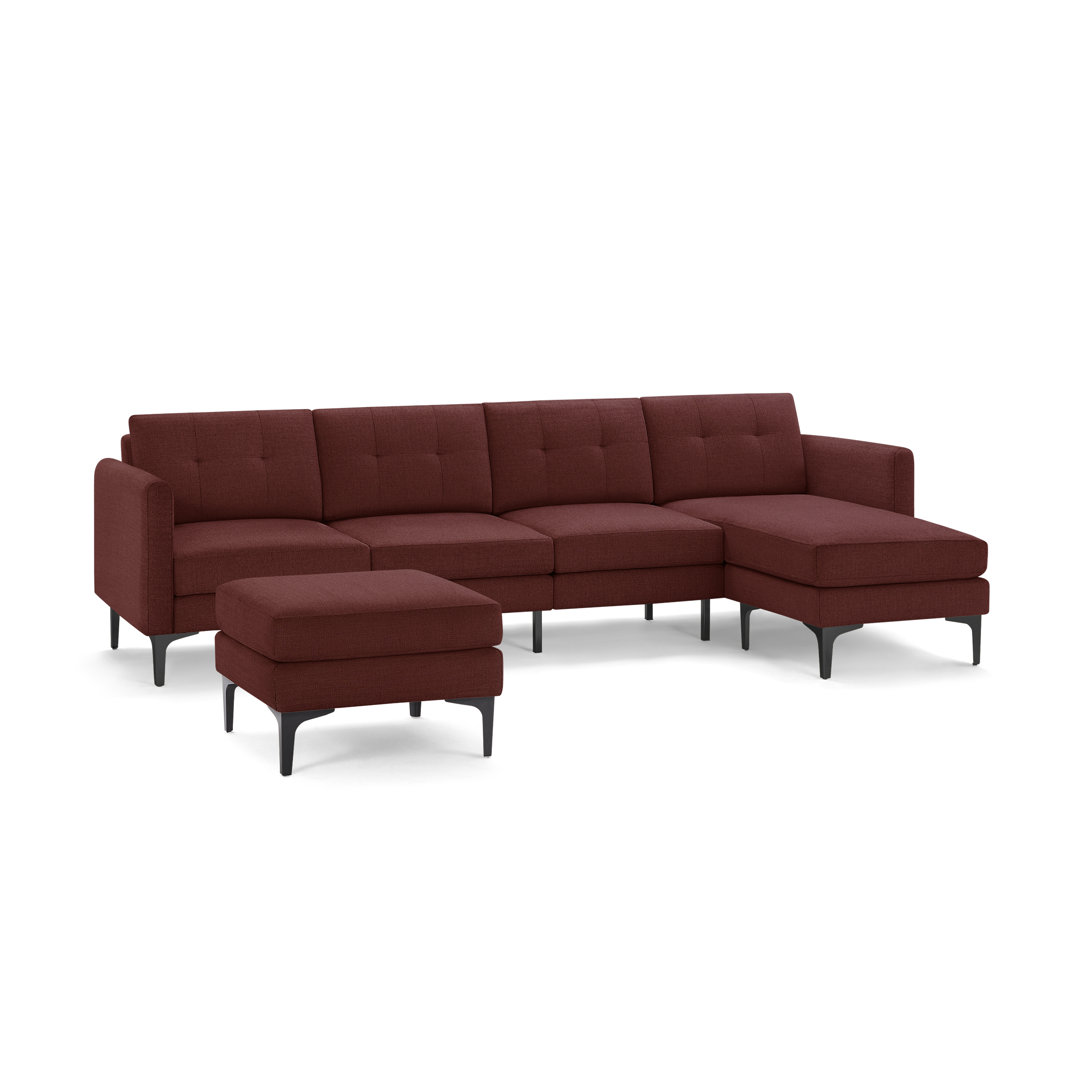 Modern sectional sofa with chaise lounge and matching ottoman, upholstered in deep red fabric with tufted cushions and black metal legs.