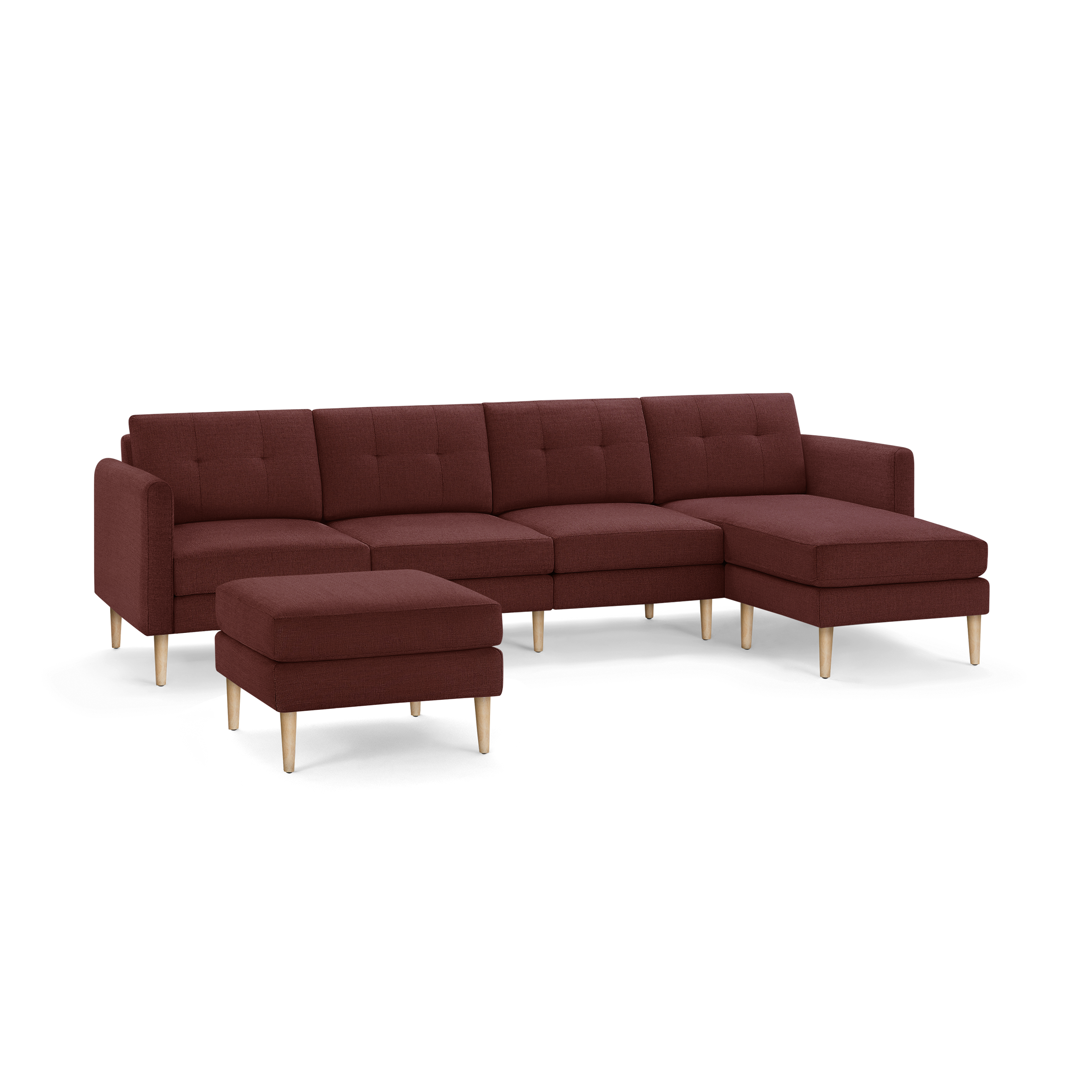 Modern sectional sofa with chaise and matching ottoman, upholstered in deep red fabric with wooden legs.