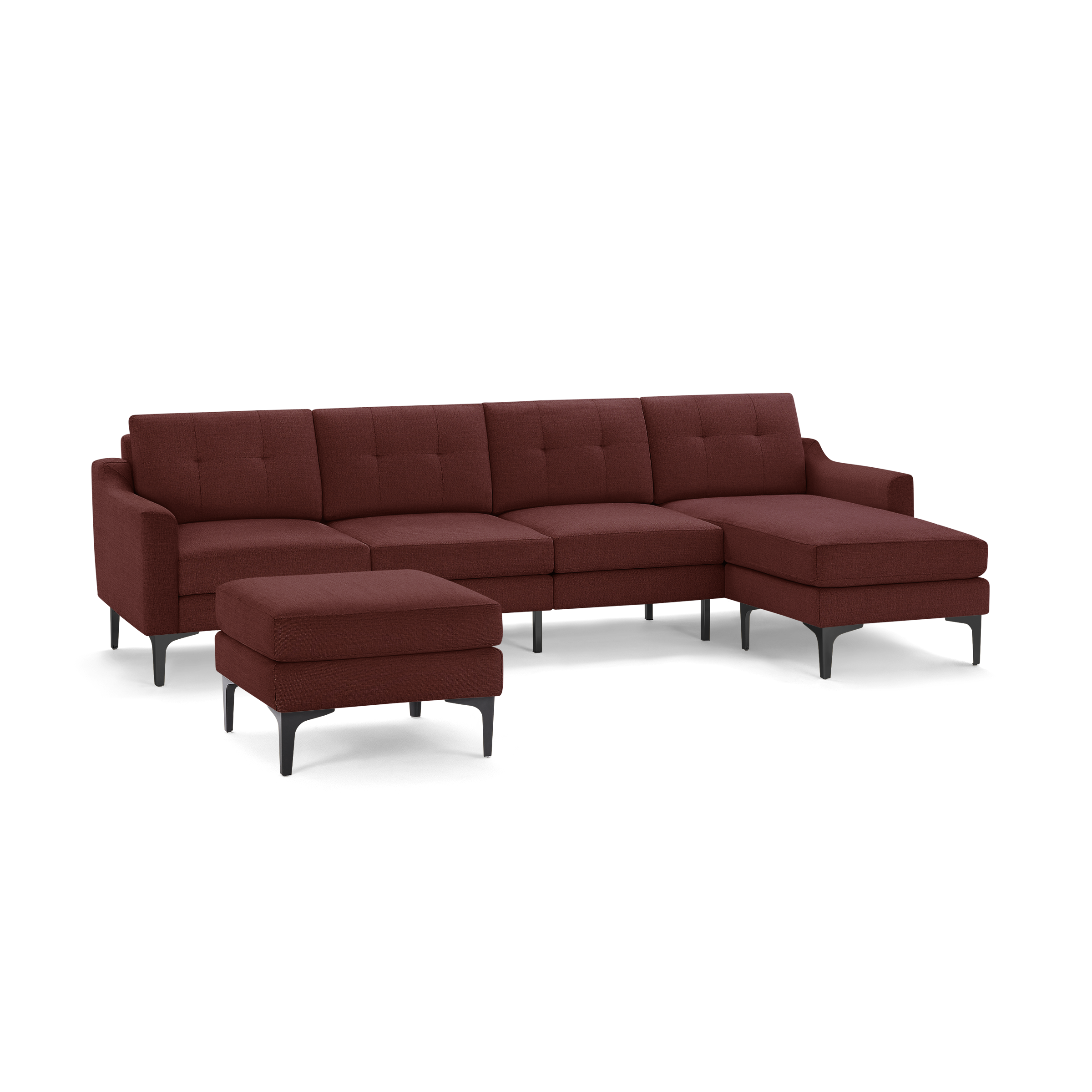 Modern sectional sofa in deep red fabric with tufted cushions, black metal legs, and matching ottoman.