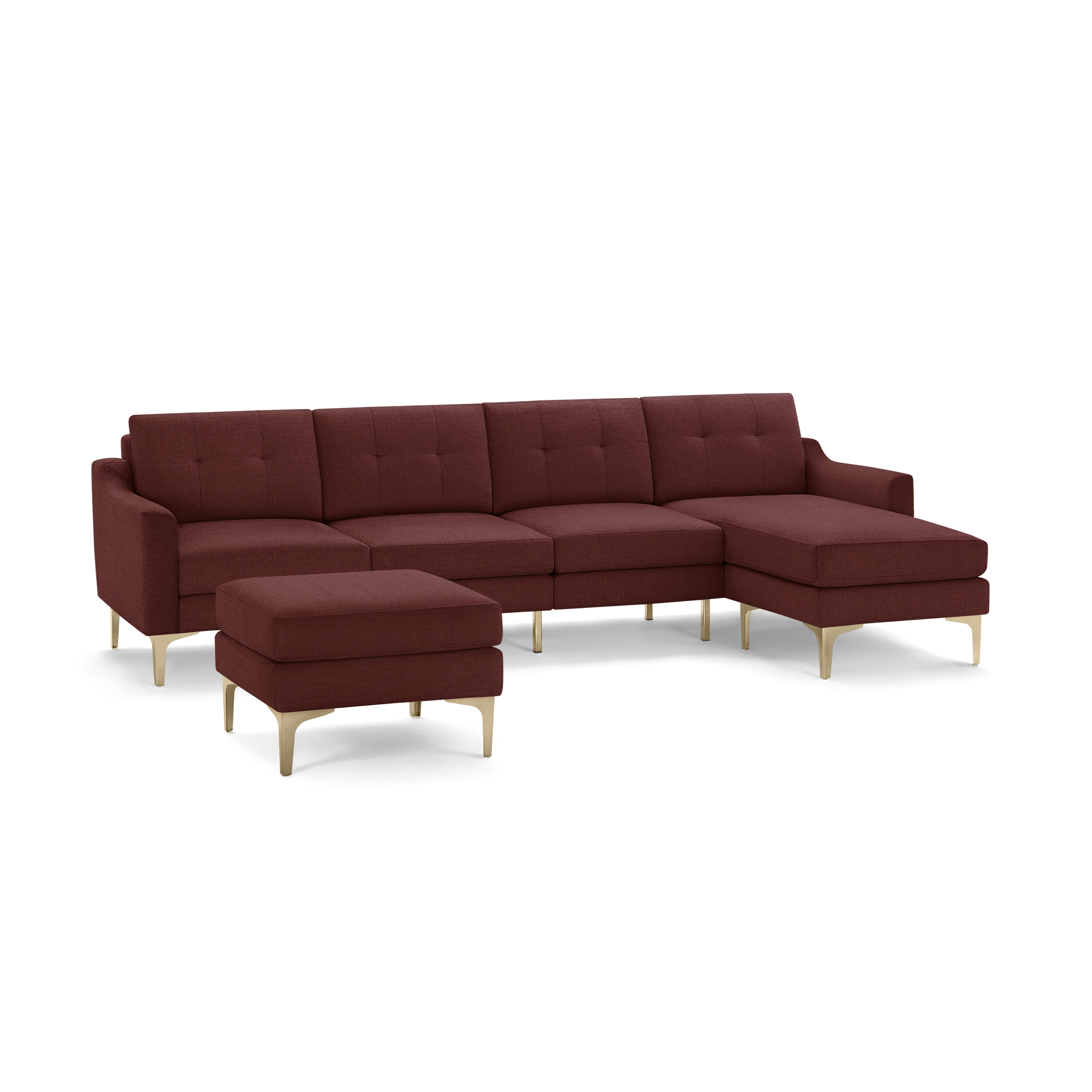 Modern sectional sofa set in deep red fabric with tufted back cushions, gold-colored angled legs, and a matching ottoman.