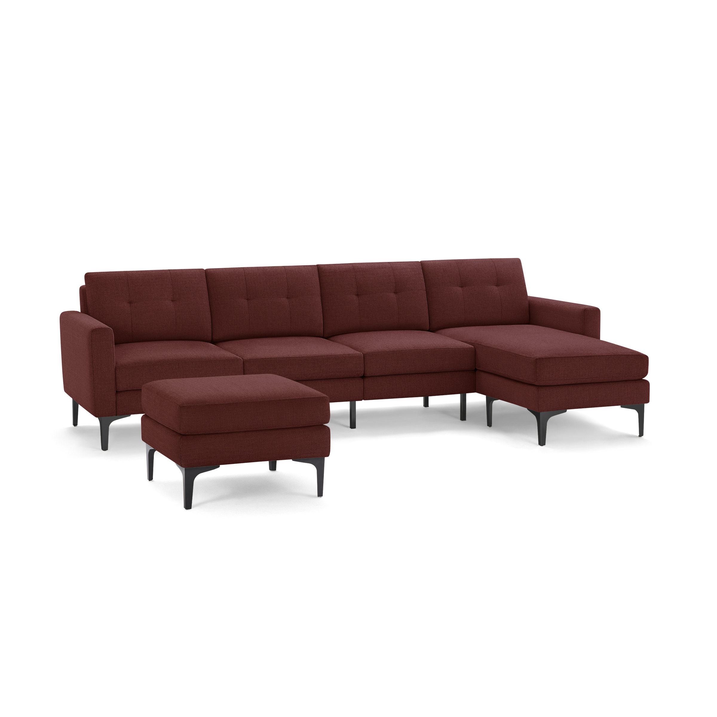 Modern sectional sofa in deep red fabric with clean lines, tufted cushions, metal legs, and a matching ottoman.