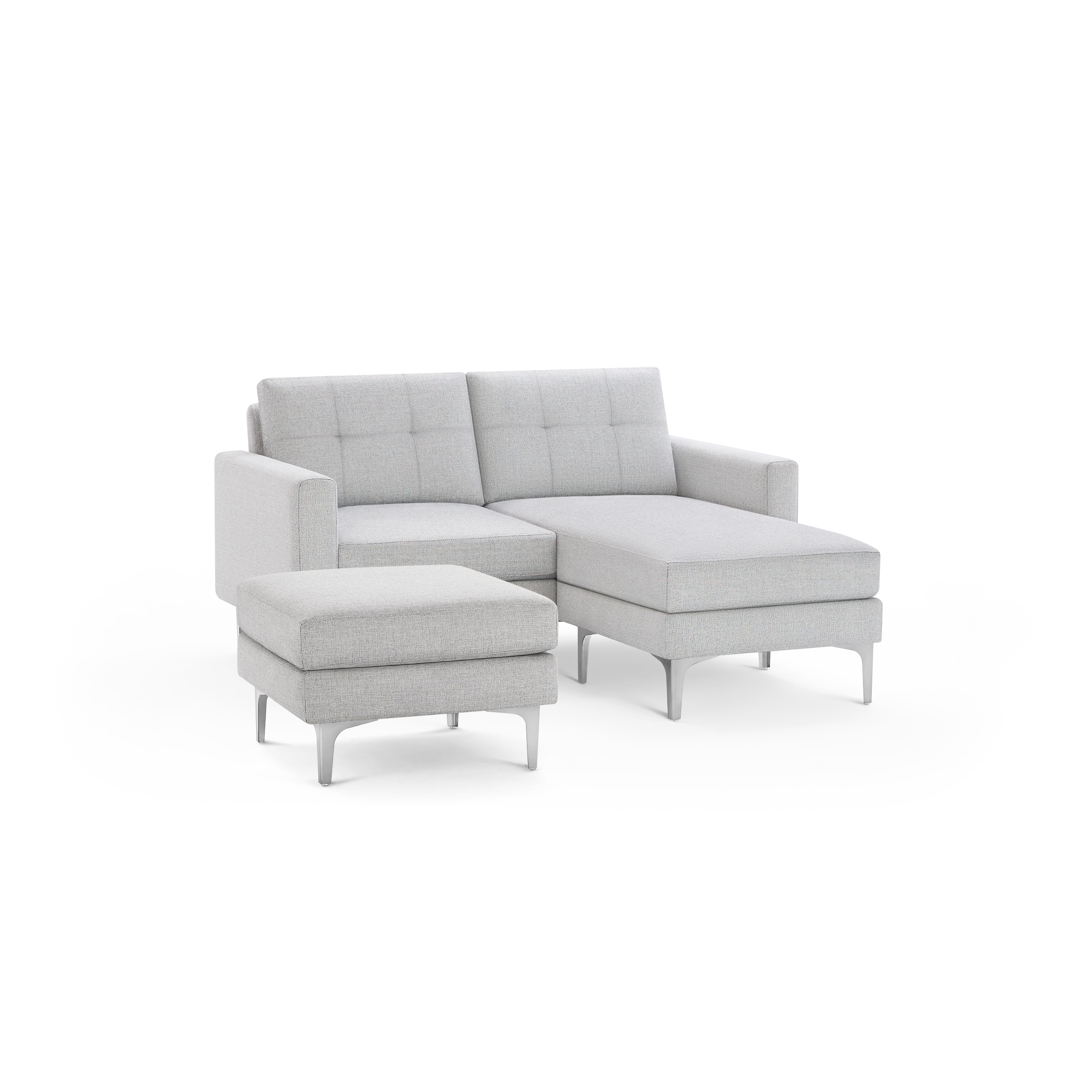 Light gray fabric sectional sofa with chaise lounge and matching ottoman, featuring tufted back cushions and sleek silver metal legs.