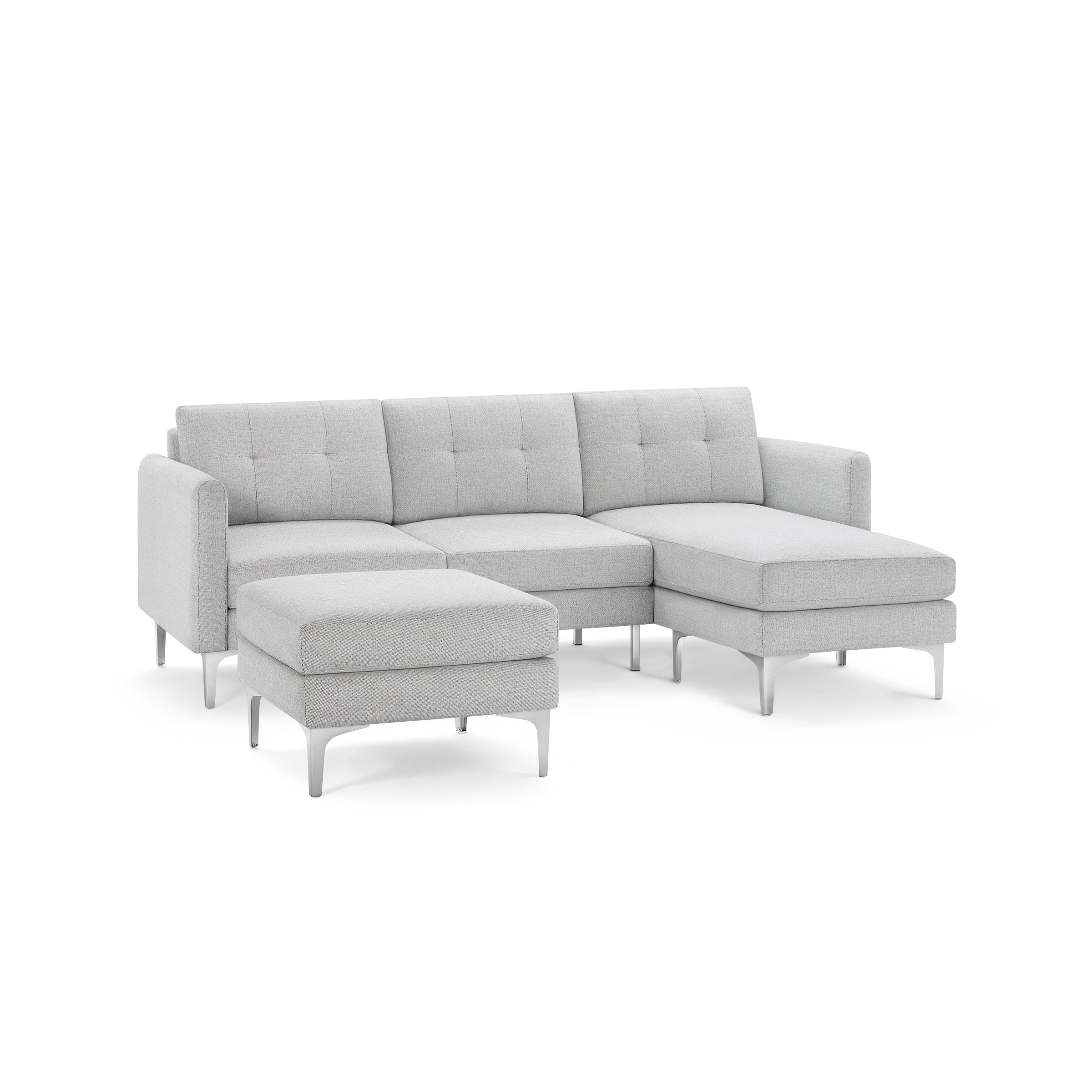 Light gray modern sectional sofa with chaise lounge and matching ottoman, featuring tufted cushions and angled metal legs.