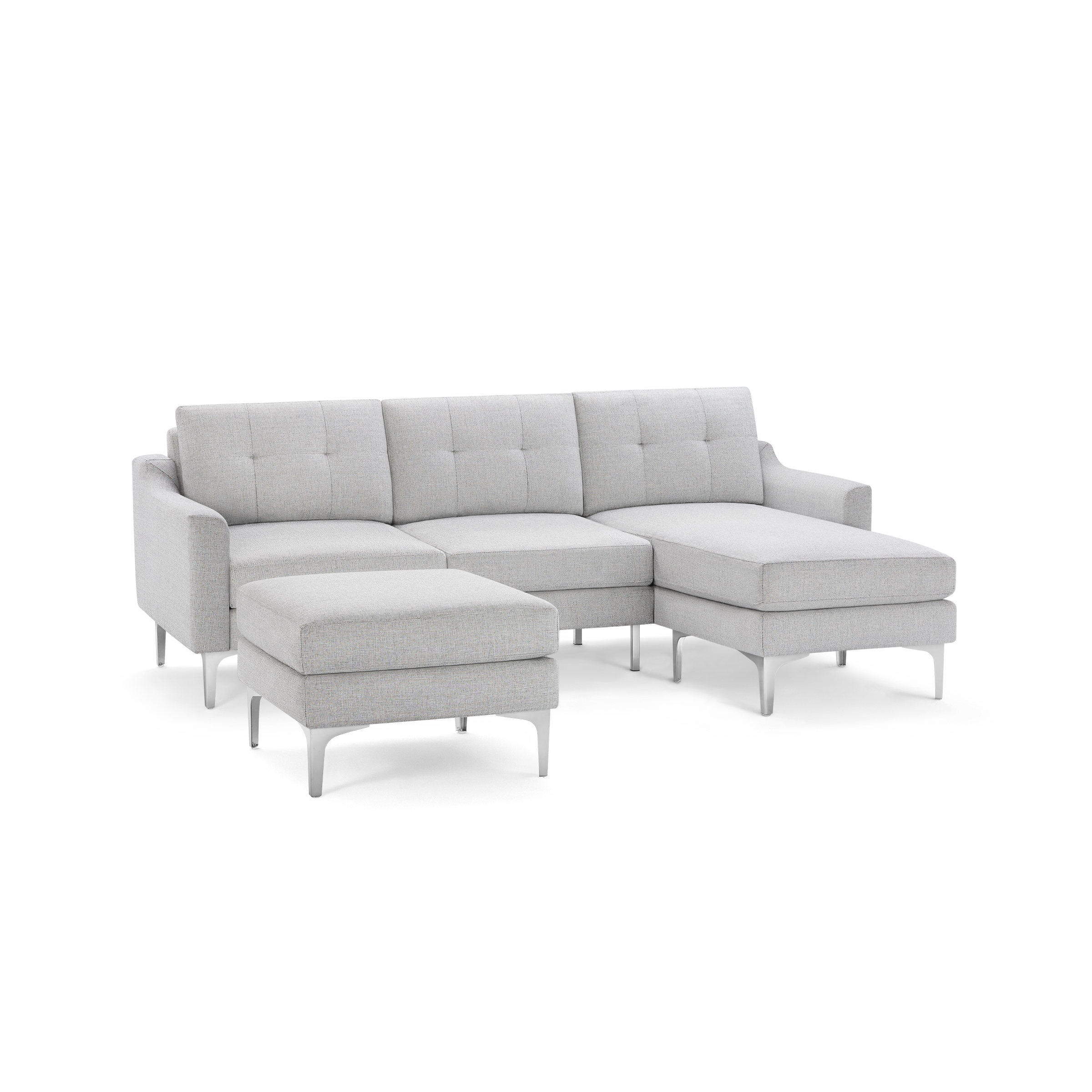 Light gray fabric sectional sofa with tufted back cushions, metal legs, and an ottoman. Modern and sleek design for living room comfort.