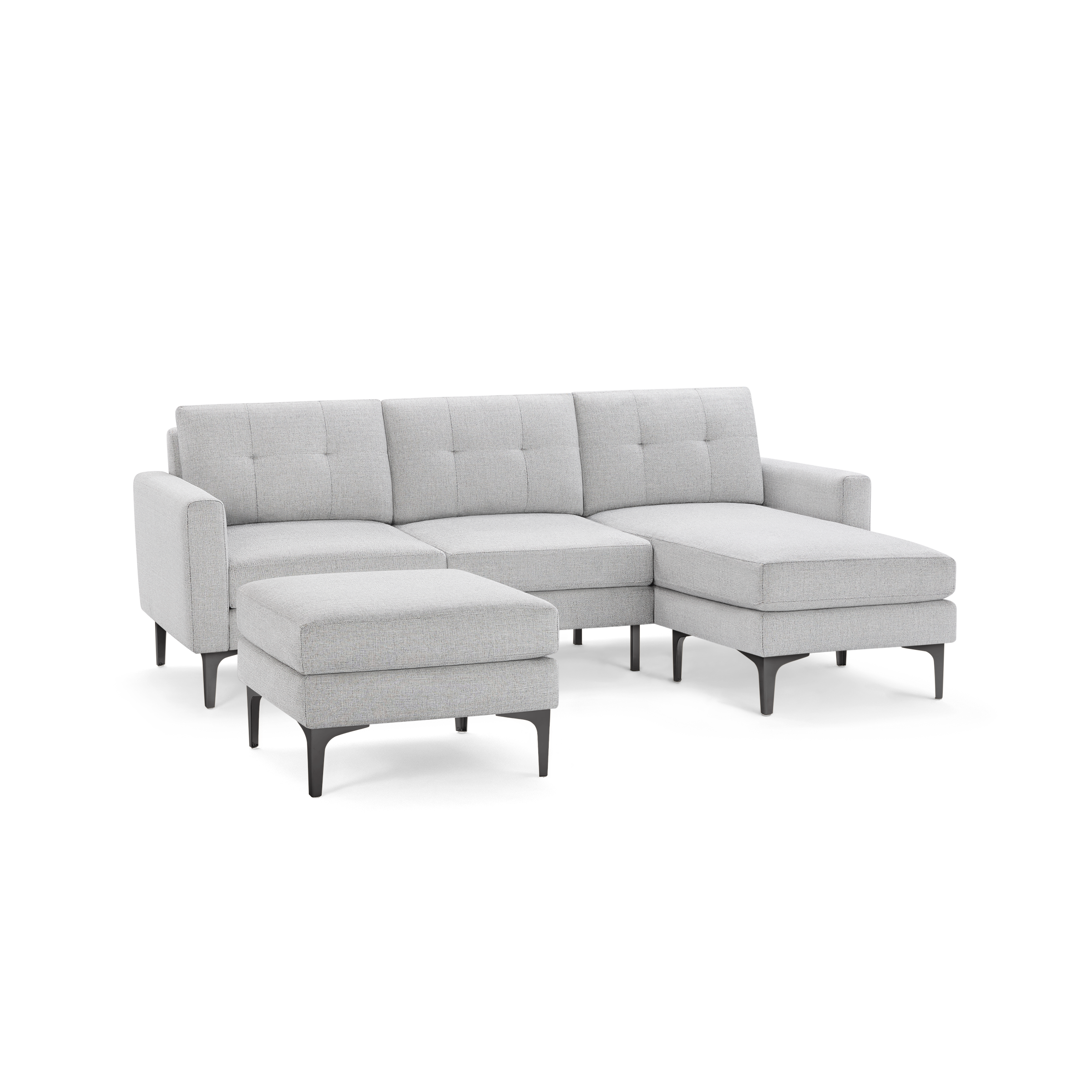Light gray fabric sectional sofa with tufted cushions, metal legs, and a matching ottoman, modern and stylish design.