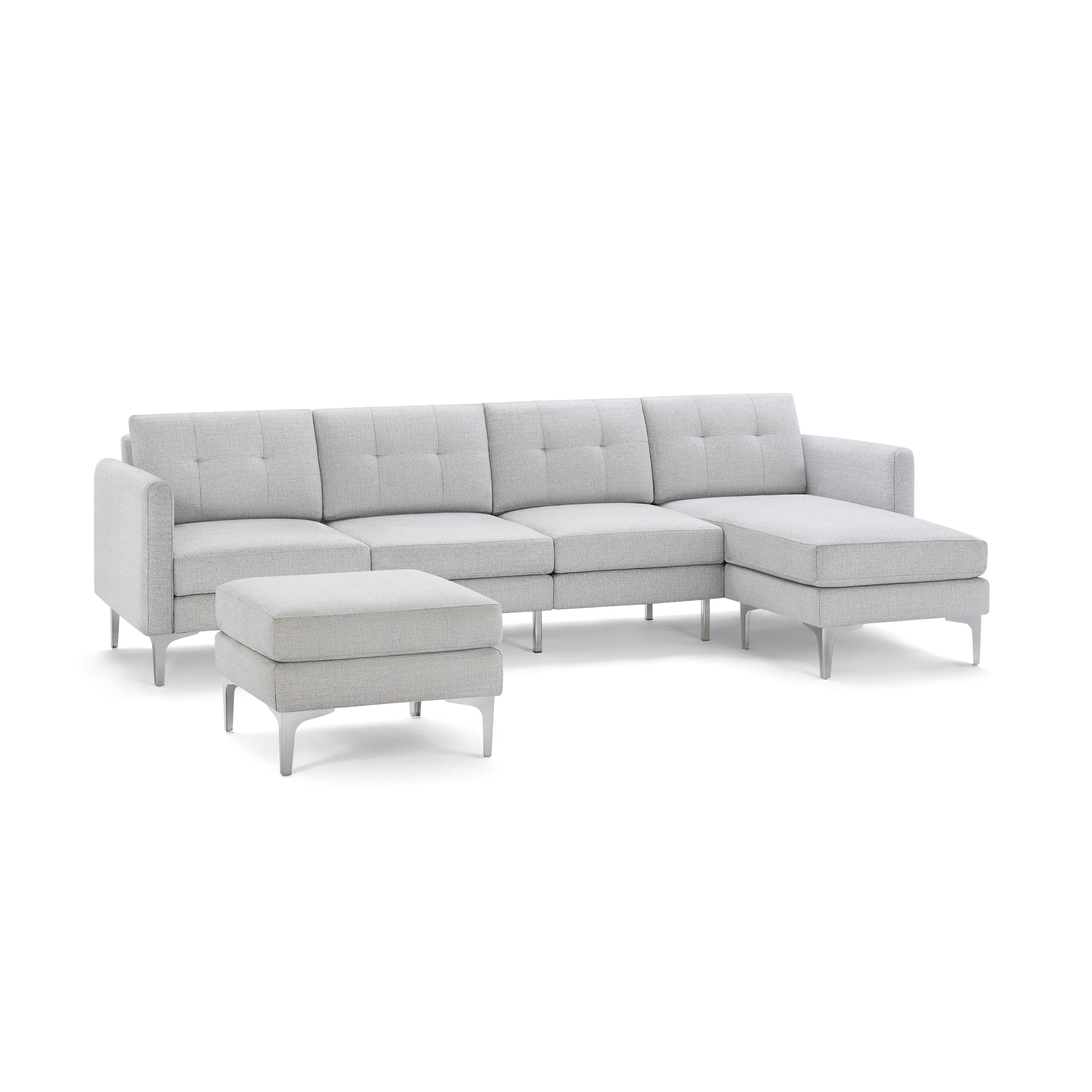 Light gray fabric sectional sofa with tufted cushions, metal legs, and matching ottoman isolated on black background.