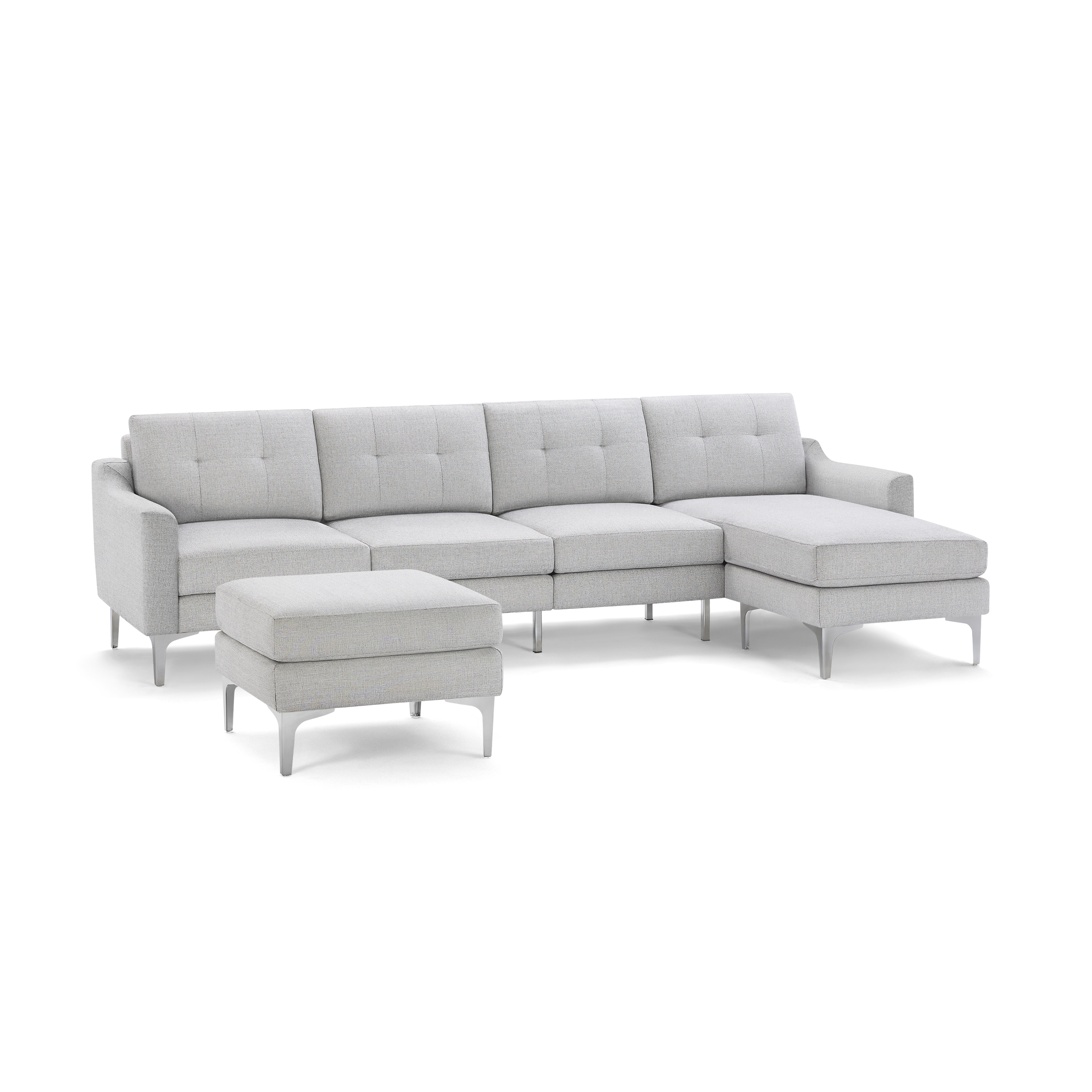 Light gray modern sectional sofa with tufted back cushions, metal legs, and a separate matching ottoman.