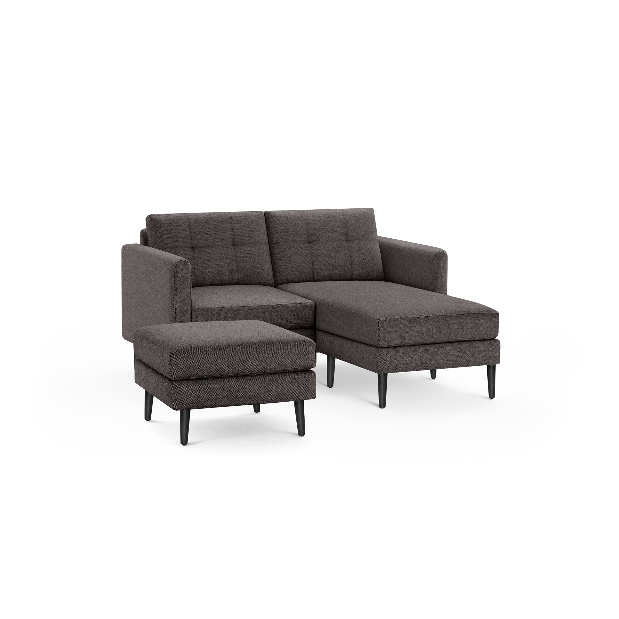 Dark gray fabric L-shaped sectional sofa with tufted backrest cushions and a matching ottoman, supported by black wooden legs.