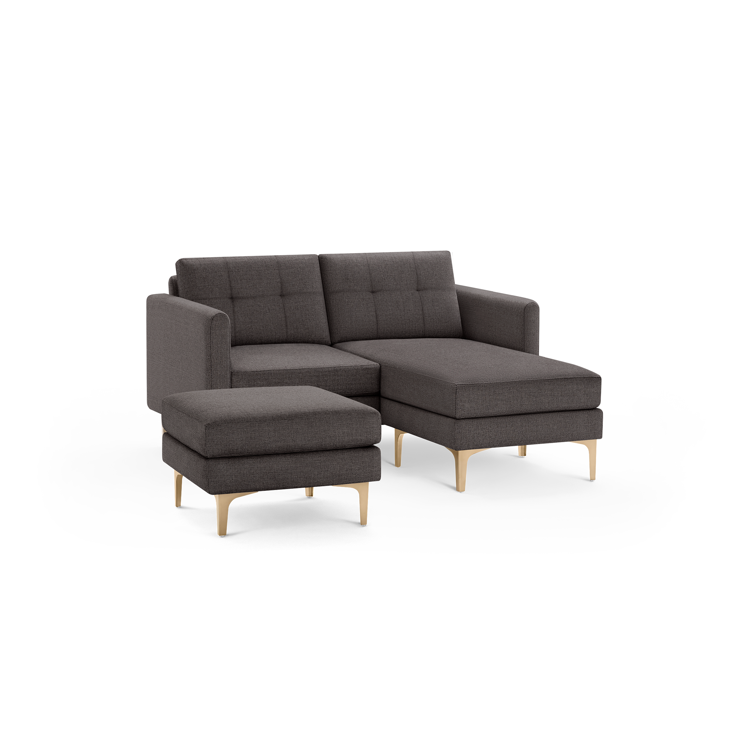 Dark gray upholstered sectional sofa with tufted back cushions, metal legs, and a matching ottoman.