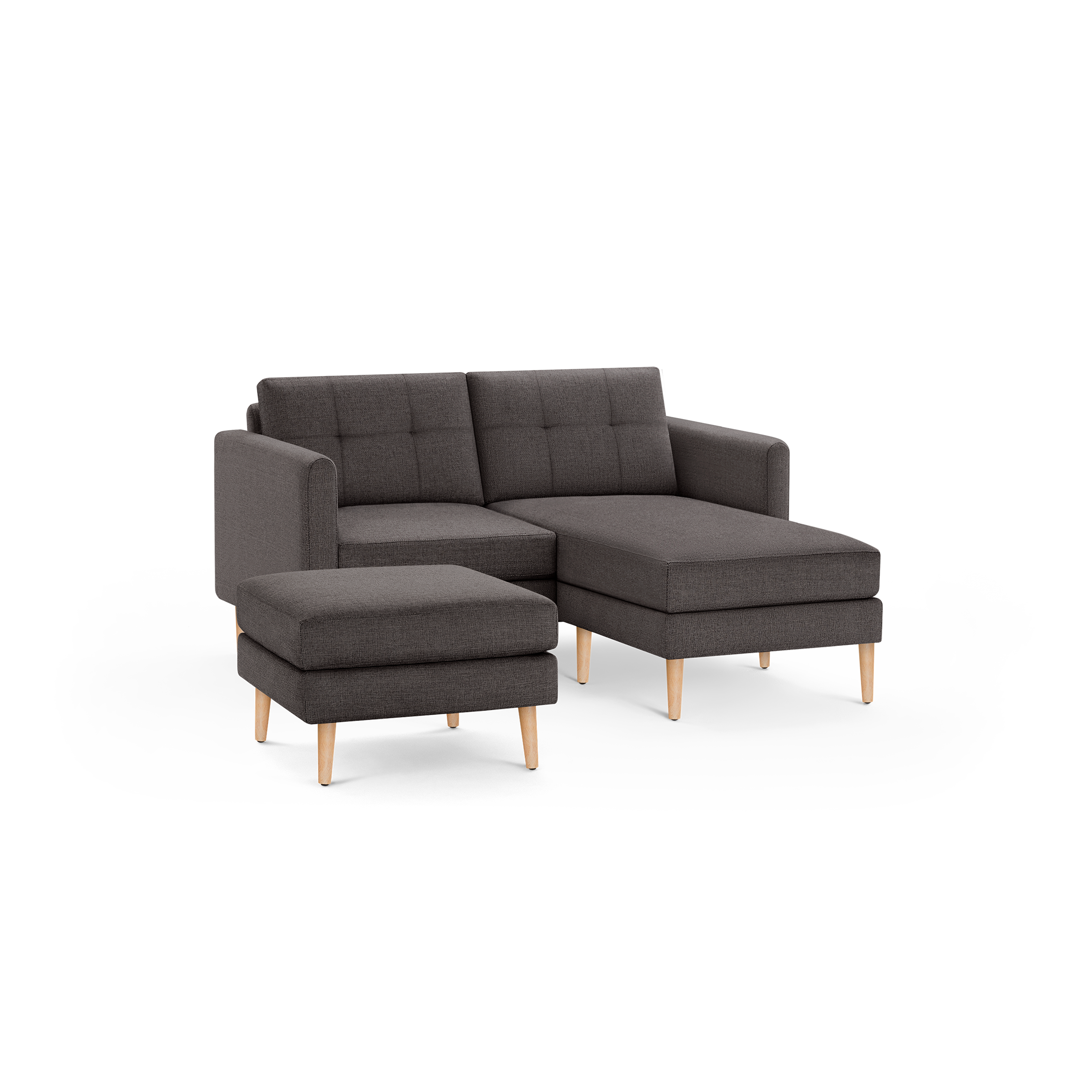 Dark gray fabric sectional sofa with tufted back cushions, wooden legs, and matching ottoman, modern and compact design.