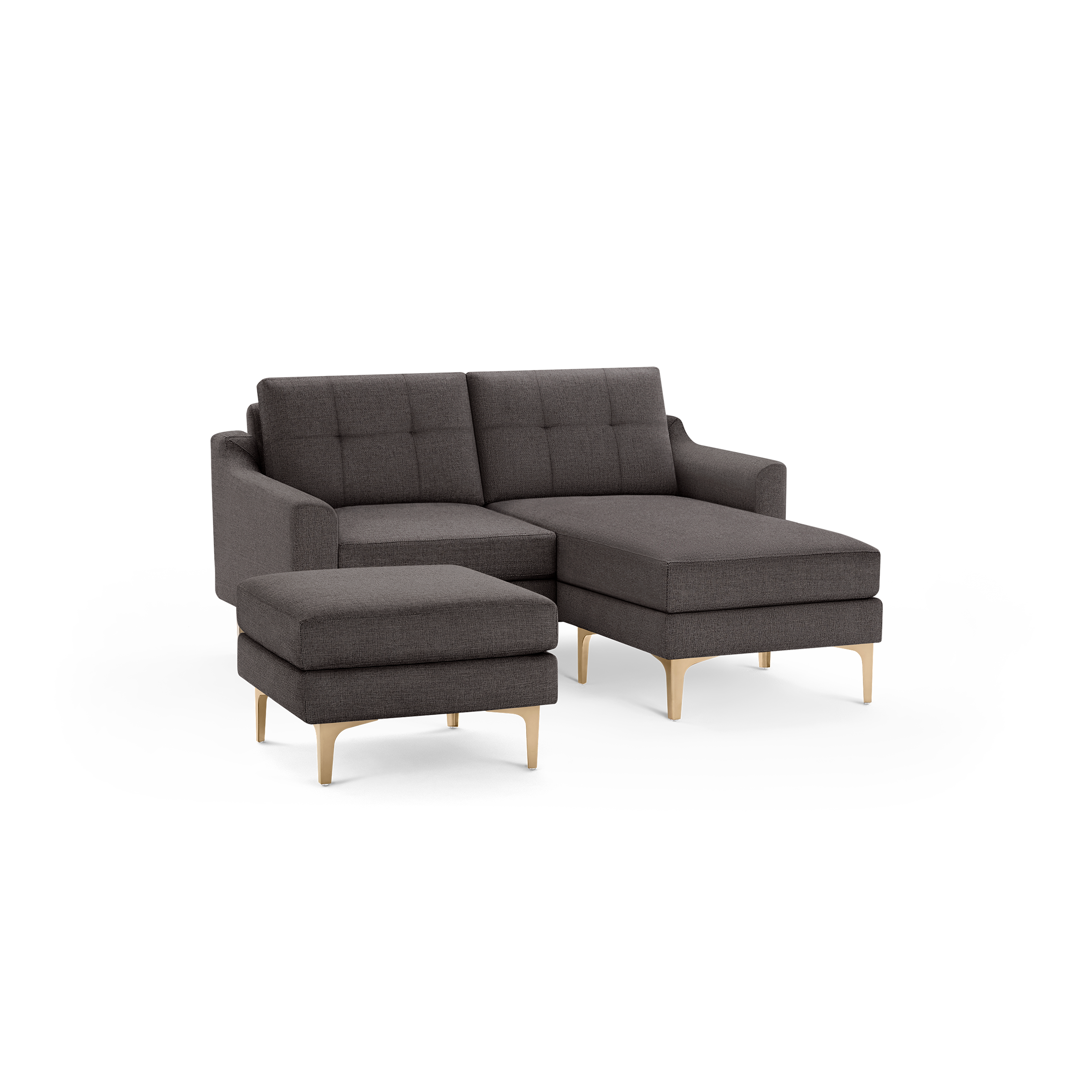 Dark gray fabric sectional sofa with tufted back cushions, wooden angled legs, and a matching ottoman.