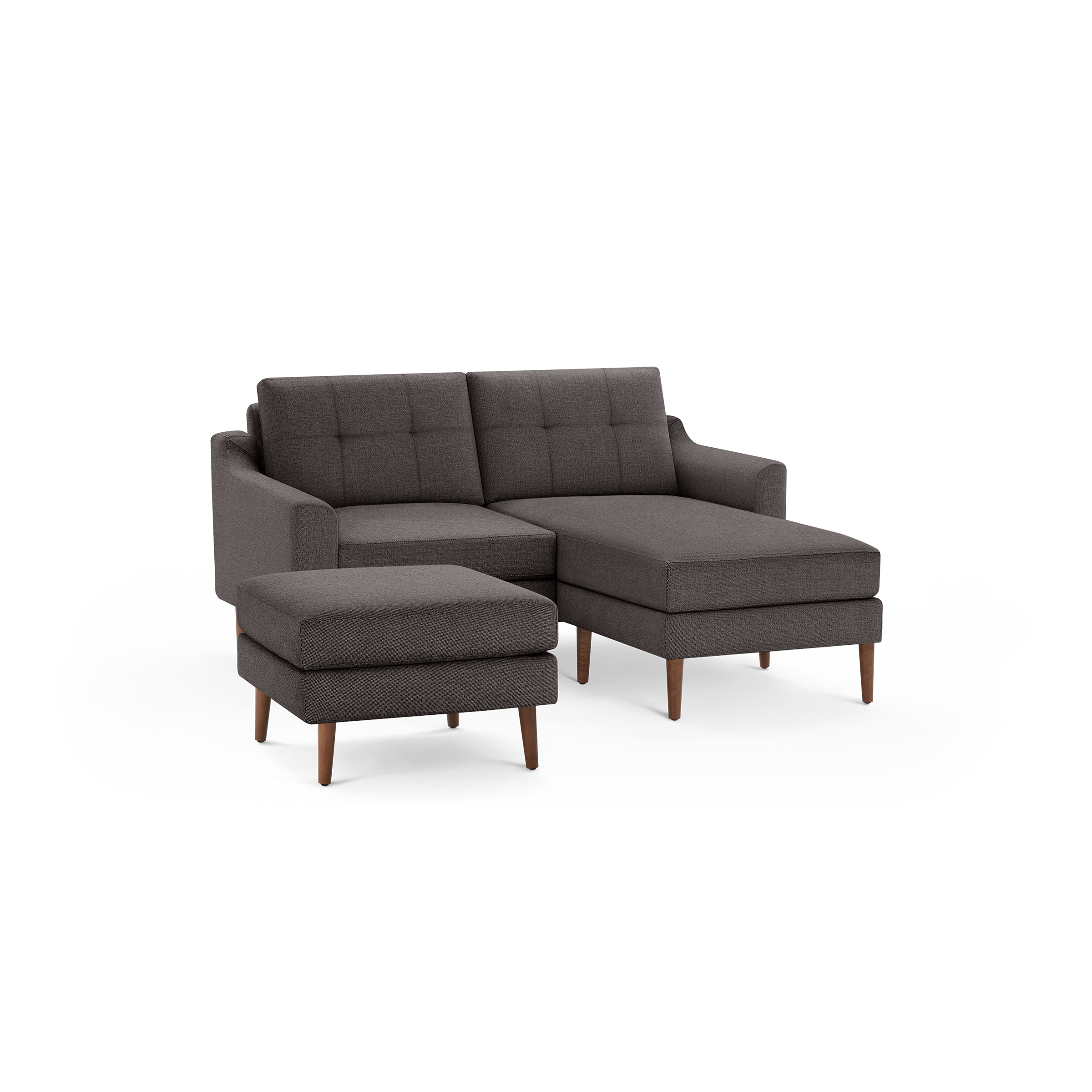 Dark gray mid-century style sectional sofa with tufted back cushions and matching ottoman, supported by wooden legs.