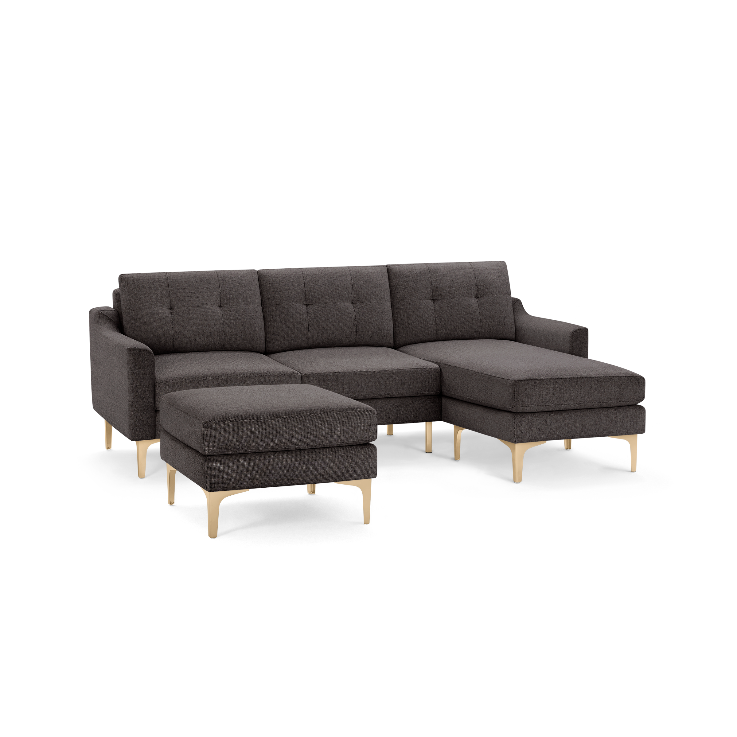 Dark gray sectional sofa with tufted cushions and light wooden legs, including a matching ottoman.