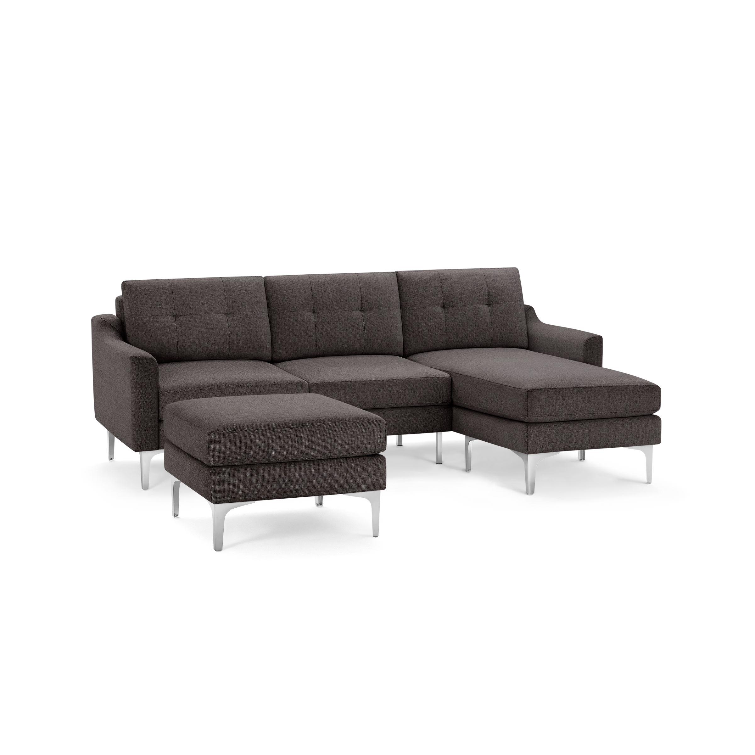 Dark gray fabric sectional sofa with tufted cushions, metal legs, and an ottoman, modern and minimalist design.