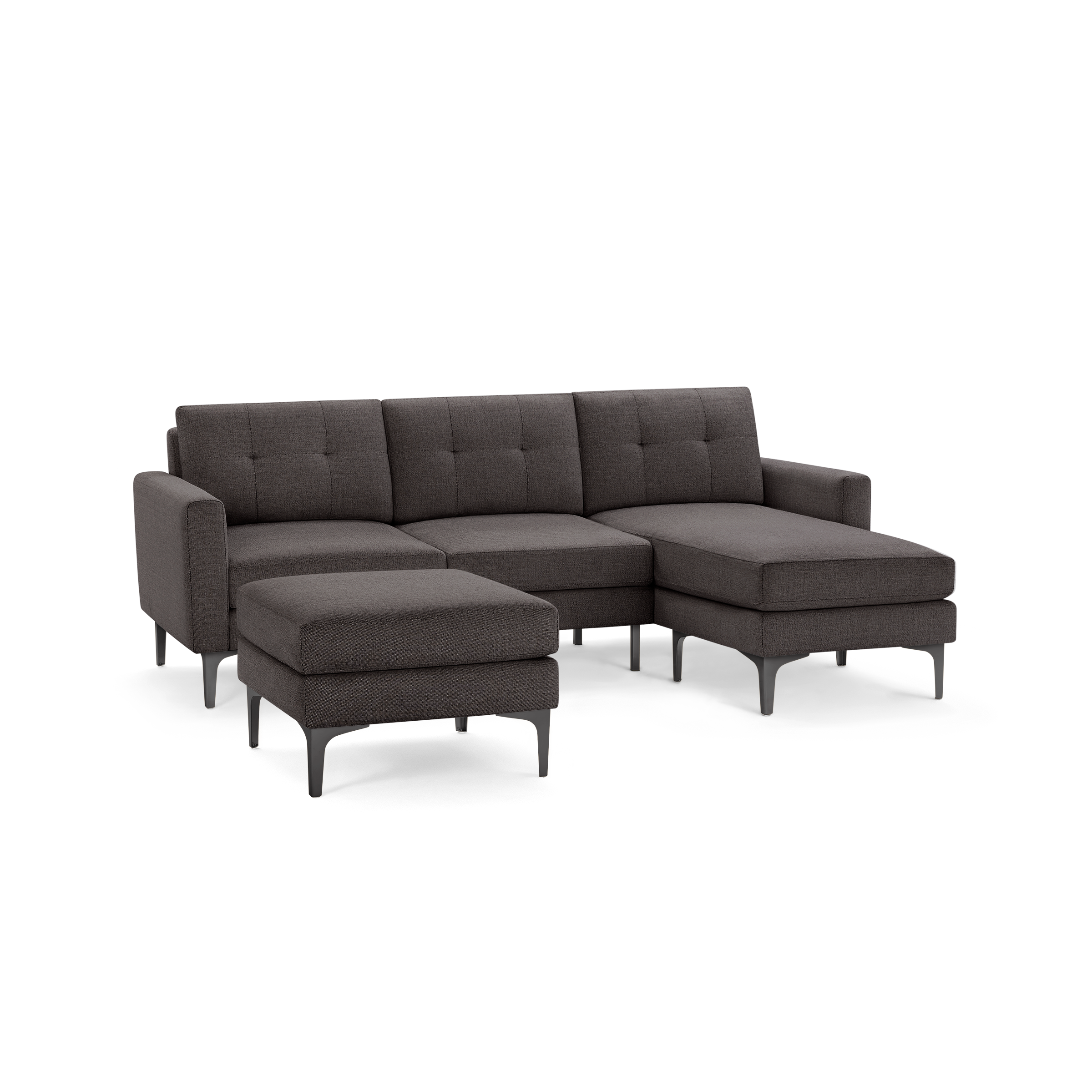Modern dark gray fabric sectional sofa with tufted back cushions, metal legs, and a matching ottoman.
