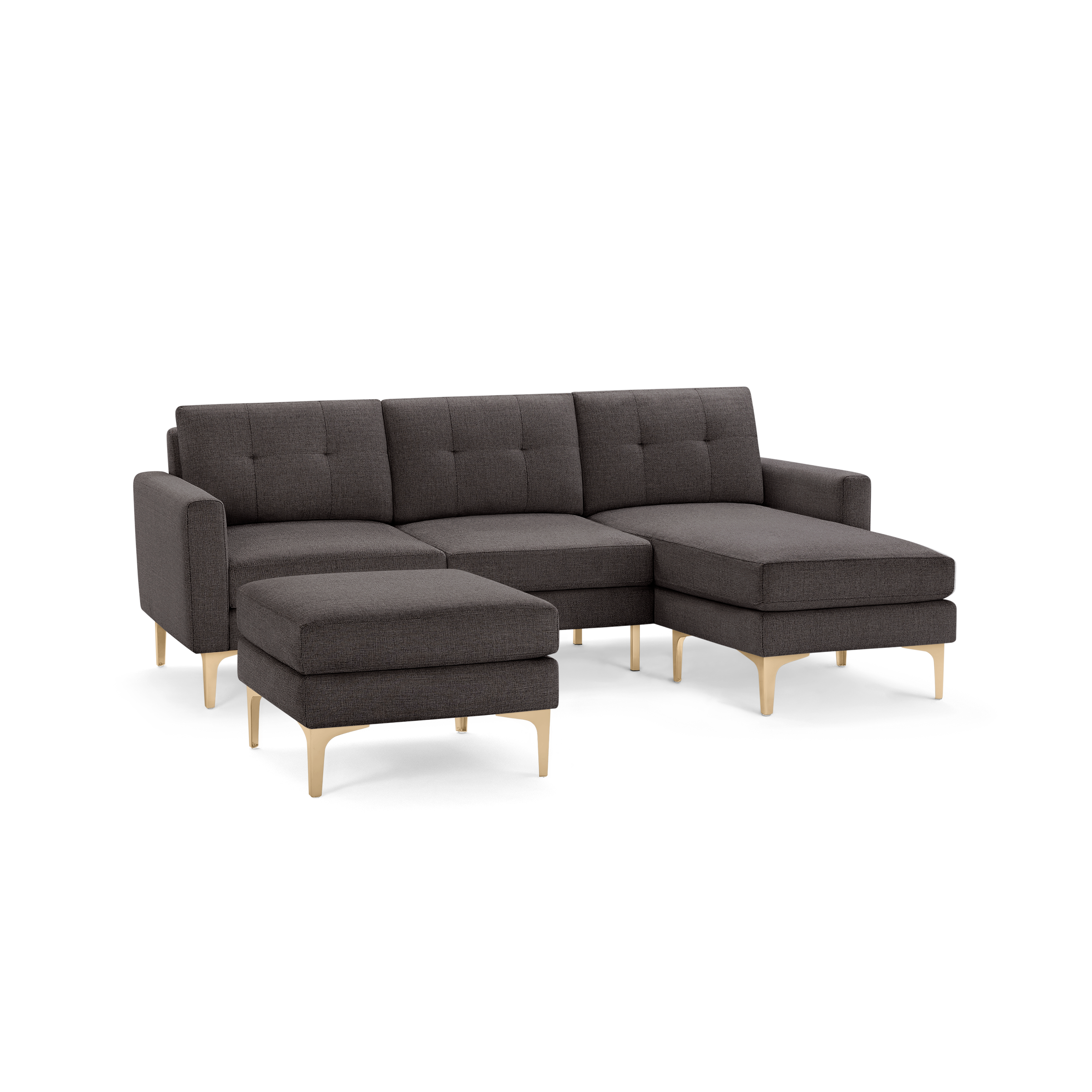 Modern dark gray fabric sectional sofa with tufted back cushions, matching ottoman, and light wooden angled legs.