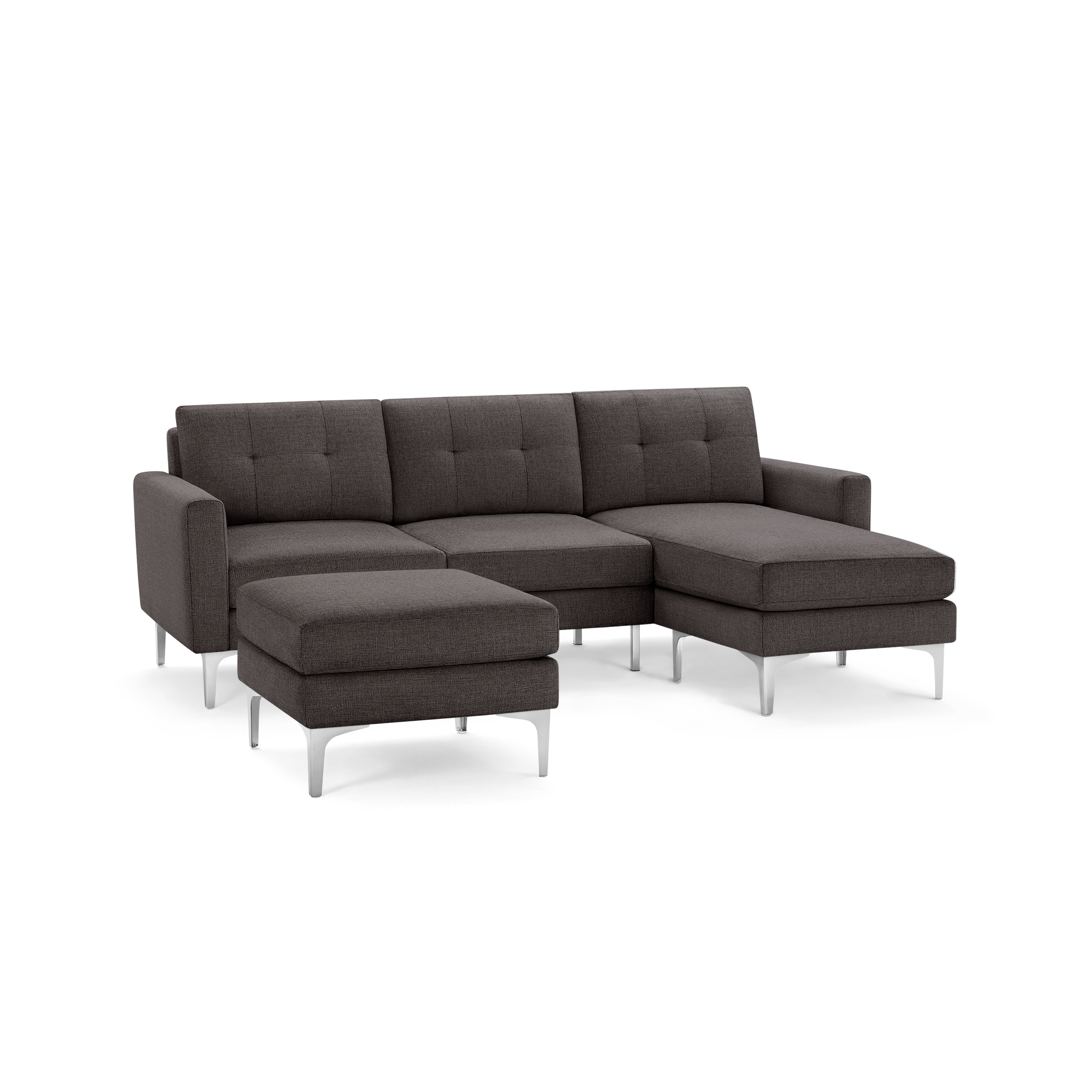 Modern dark gray fabric sectional sofa with chaise lounge and matching ottoman, featuring tufted back cushions and metal legs.