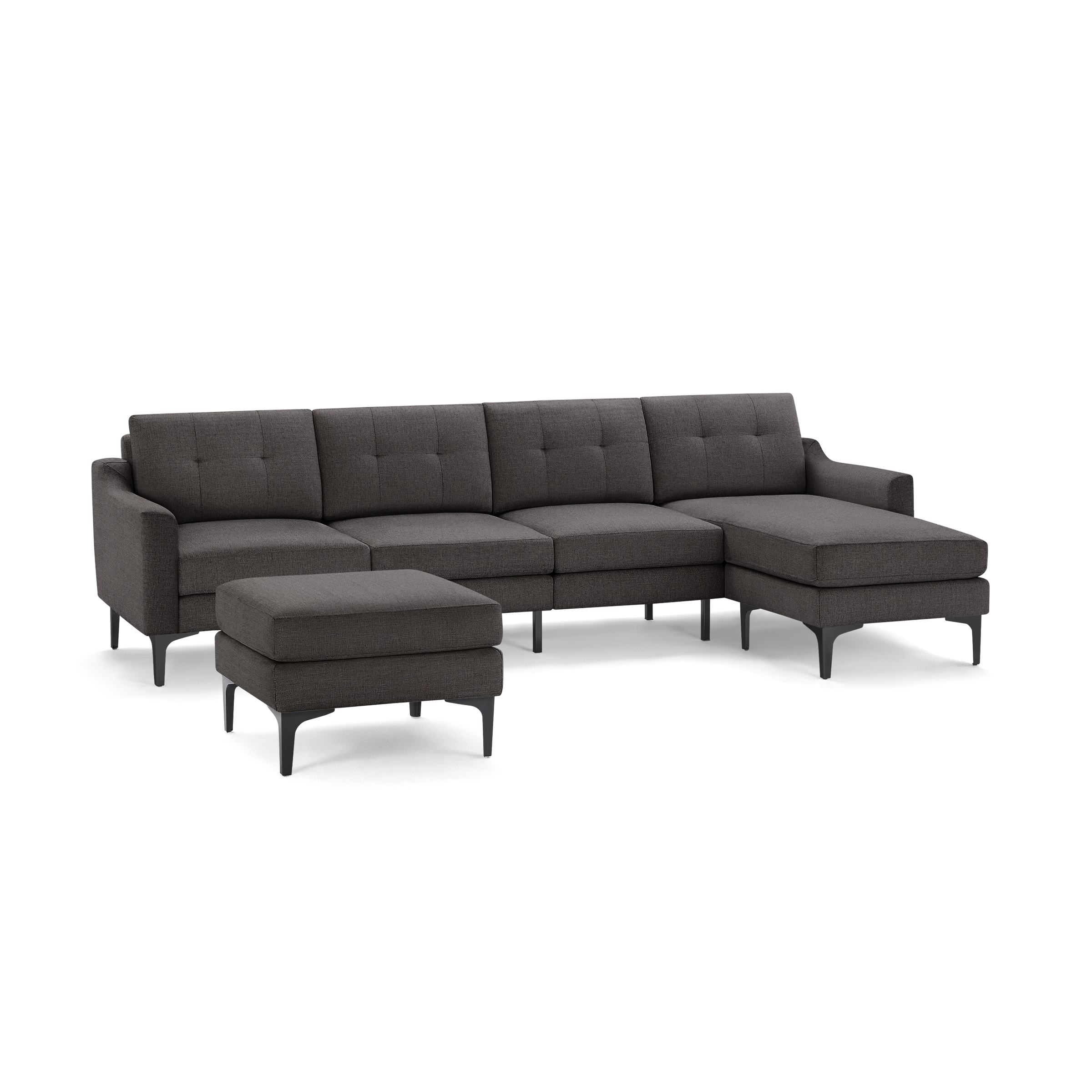 Dark gray modern fabric sectional sofa with tufted cushions, right-side chaise, and matching ottoman on black metal legs.