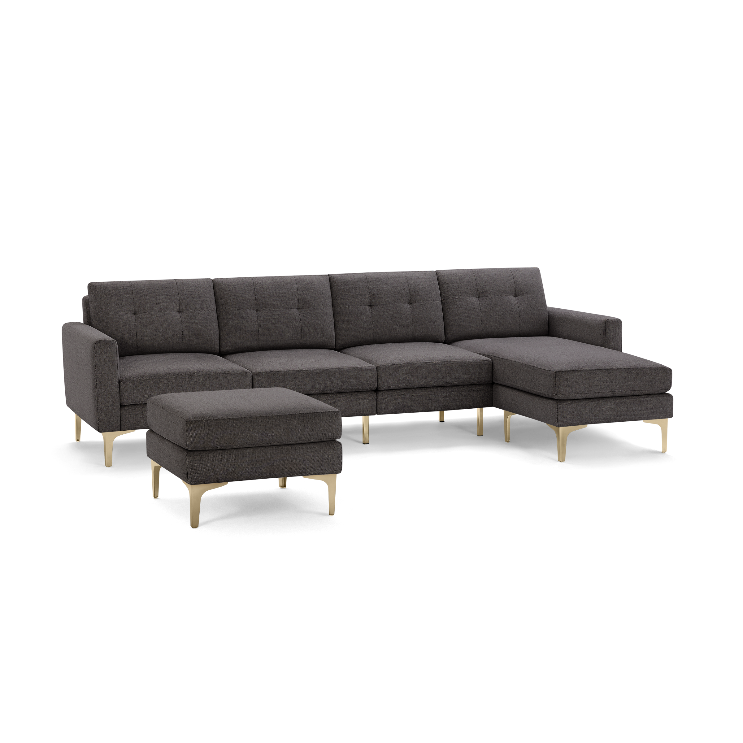 Modern dark gray fabric sectional sofa with tufted cushions, sleek gold metal legs, and matching ottoman.