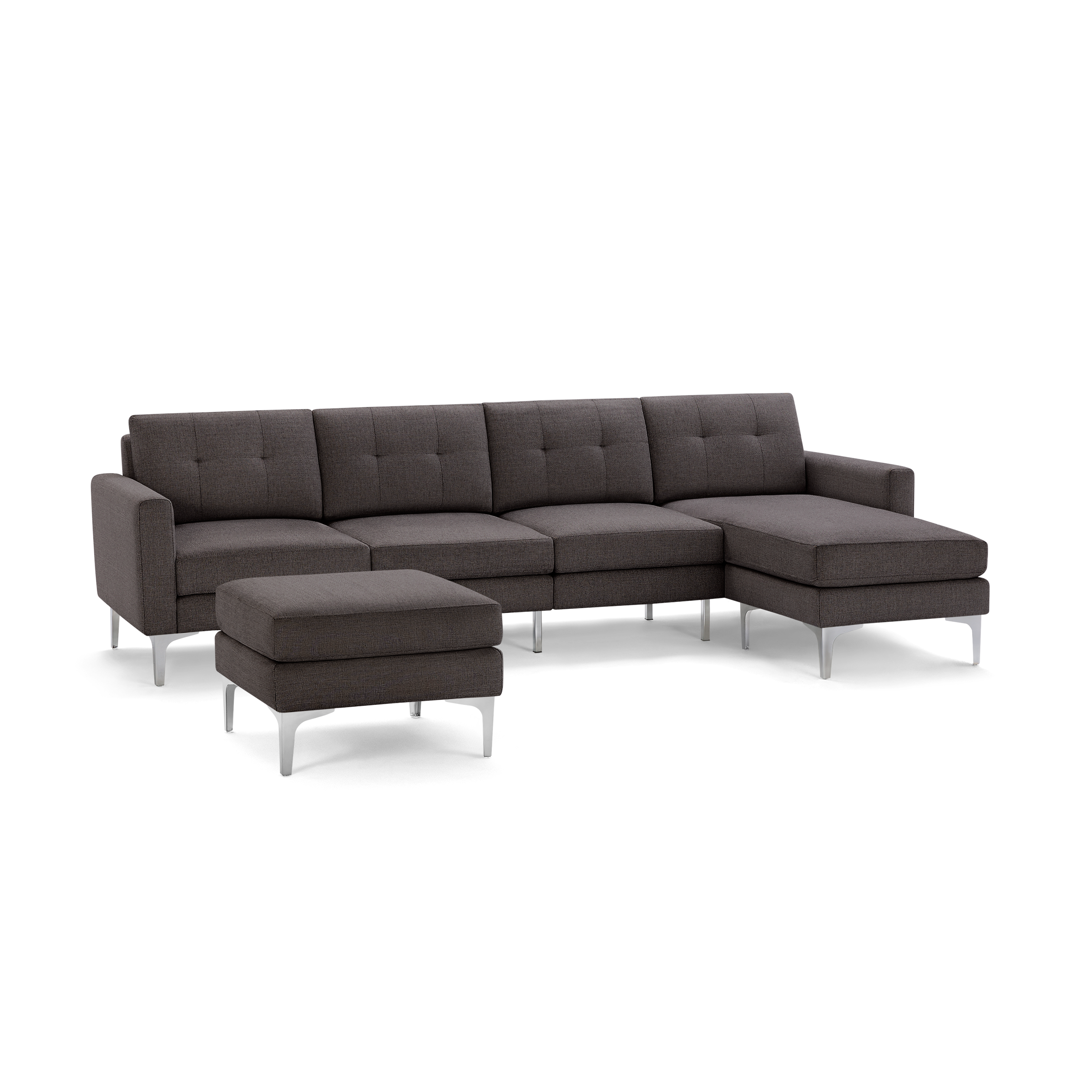 Modern dark gray sectional sofa with tufted cushions, metal legs, and matching ottoman.